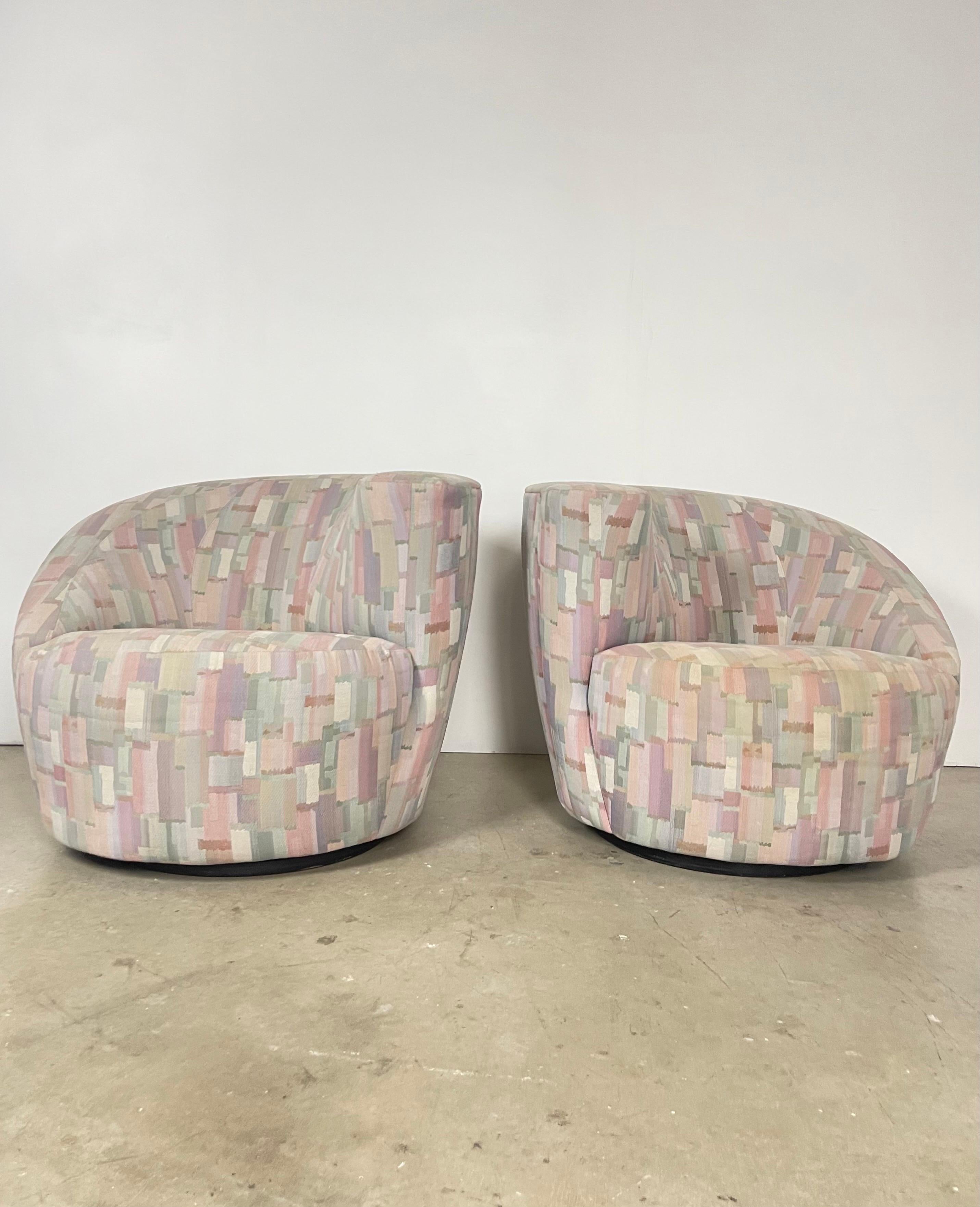 Pair of Vladimir Kagan Nautilus Chairs with Original Pastel Fabric, Light Wear

Description:
Up for sale is a pair of Nautilus chairs attributed to Vladimir Kagan, one of his most iconic designs. These chairs feature a unique curved shell shape