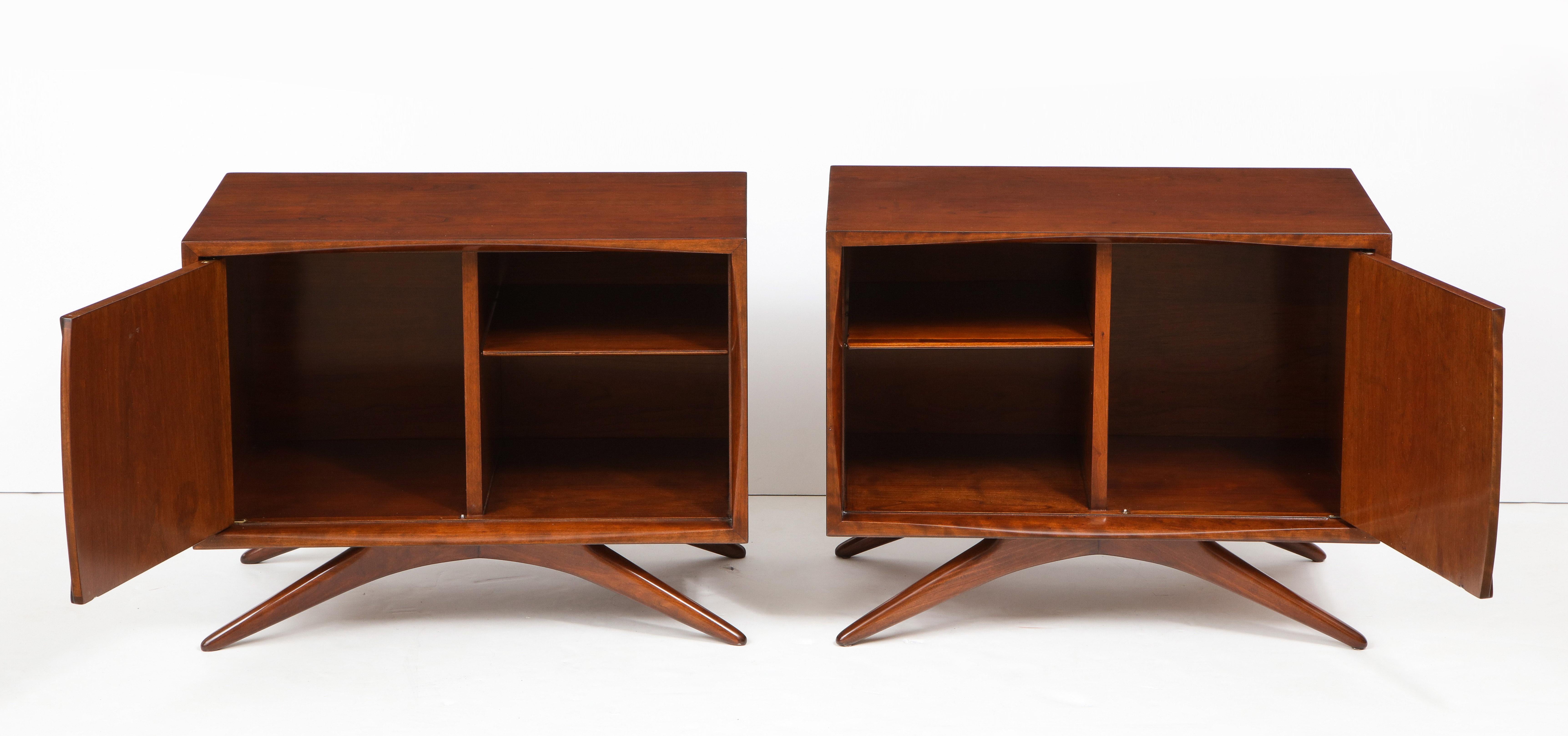 Vladimir Kagan design nightstands for Grosfeld House, N.Y. Perfectly refinished in a medium walnut color with one door and one adjustable shelf.