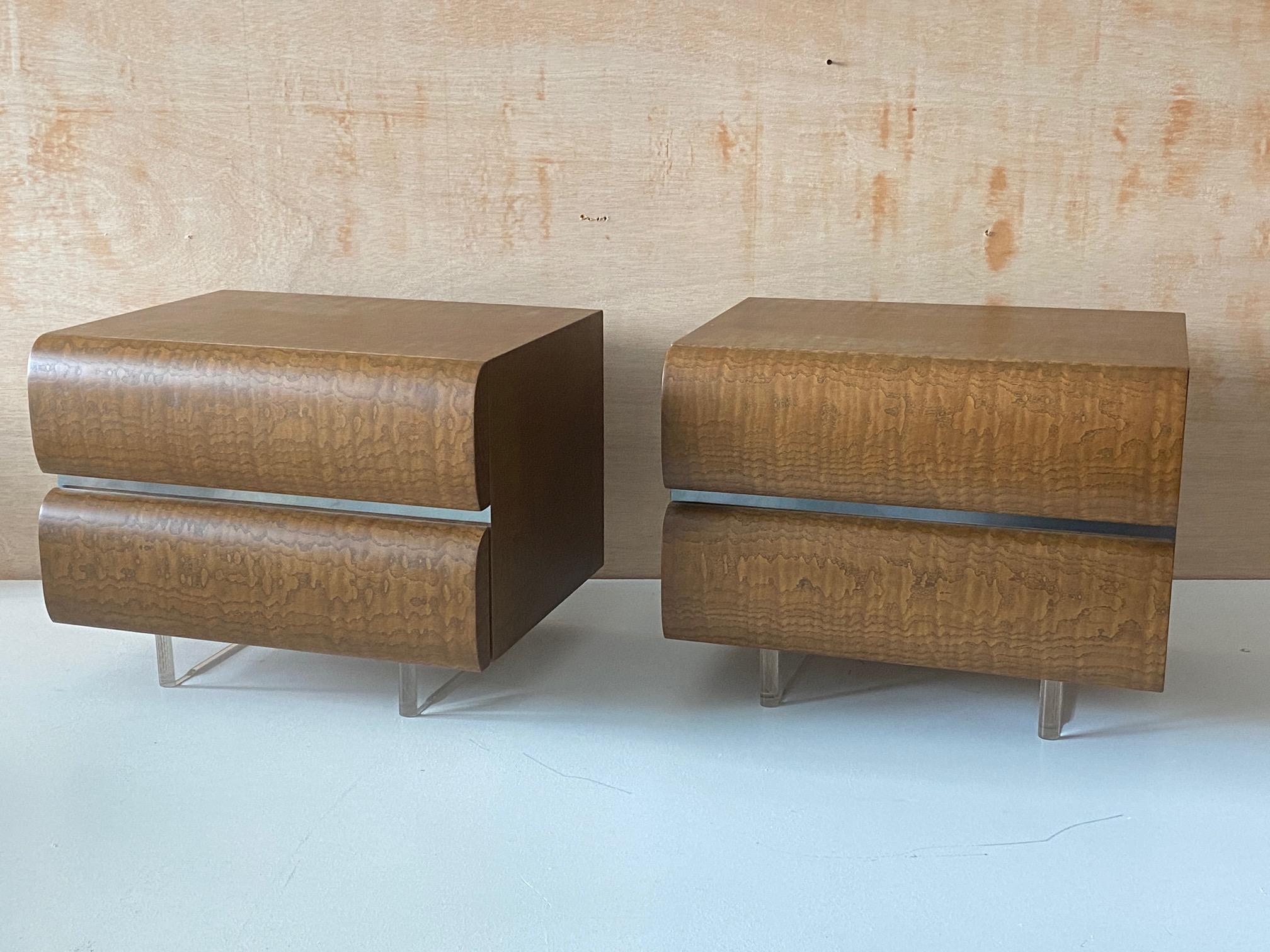 A pair of nightstands / bedside cabinets. Designed by Vladimir Kagan. Produced by Vladimir Kagan Inc. Marked with manufacturers plaque reading 