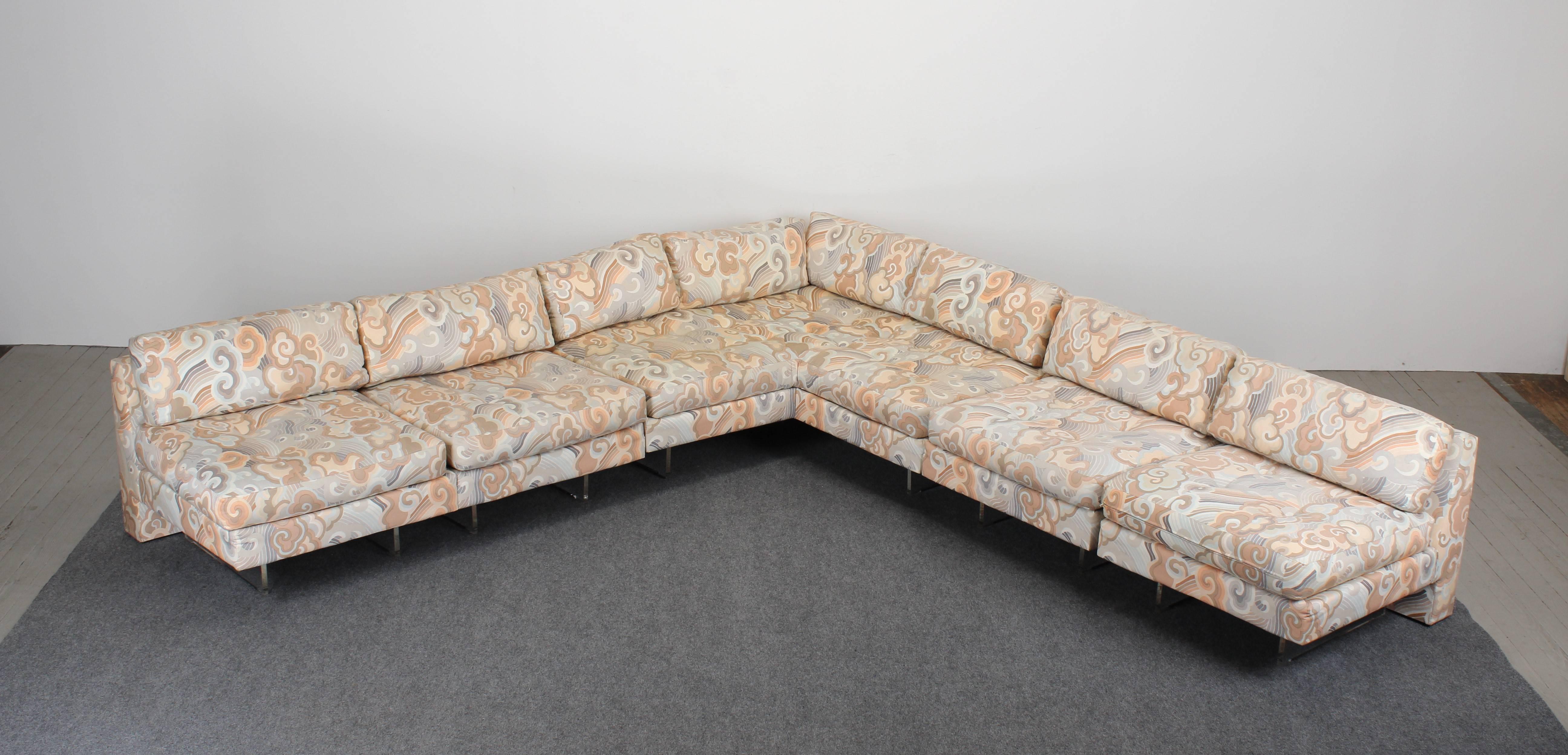 A large, functional Vladimir Kagan omnibus L shaped sectional sofa with Lucite floating bases, 1980. Sofa is in very good condition.
Dimensions:
Seat height 18