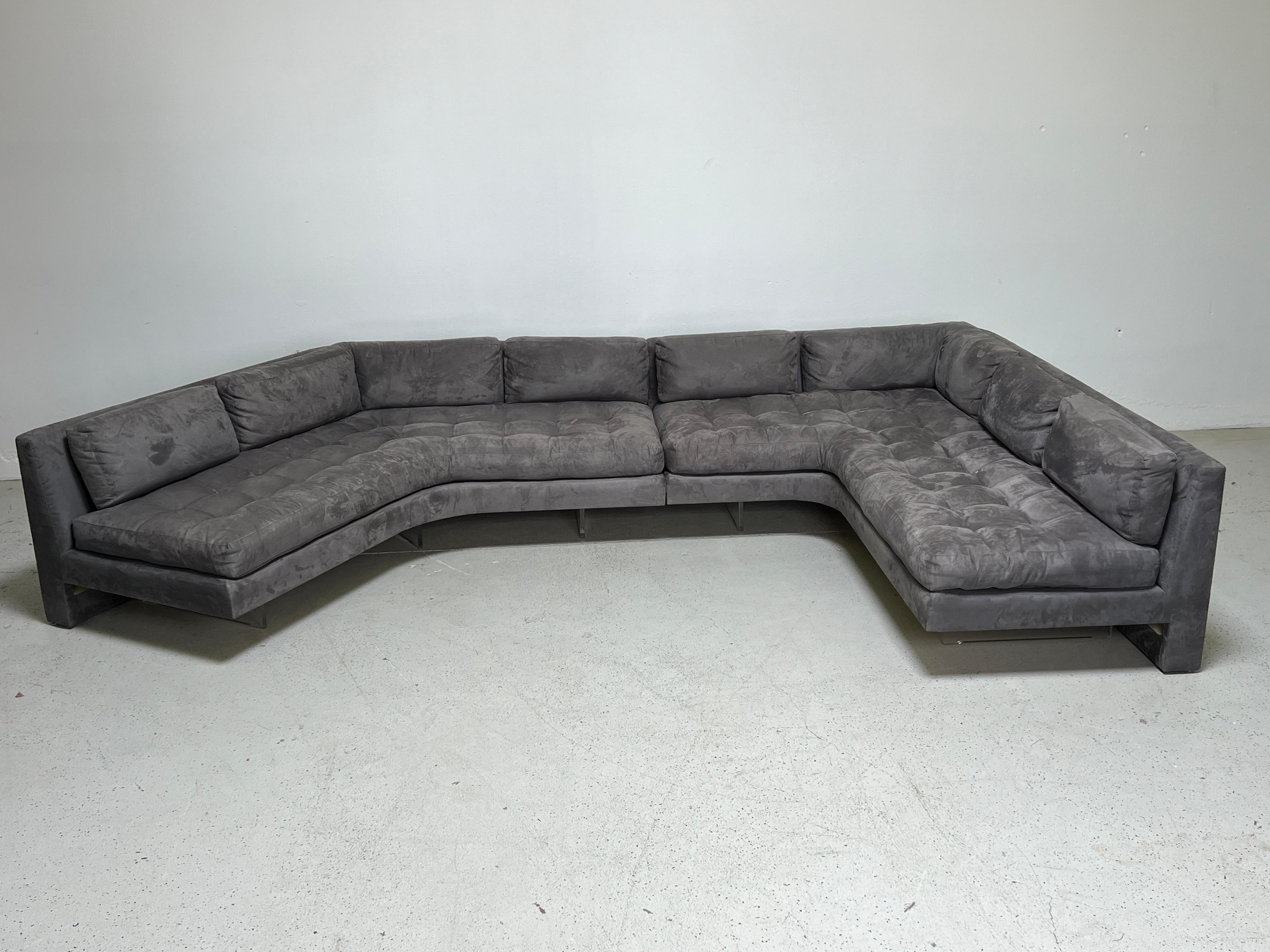 A two piece Omnibus sectional sofa designed by Vladimir Kagan. The two pieces can be rearranged as shown in photos. The original built-in lighting was an upgrade offered by Kagan. Very comfortable with down seat and back cushions. Reupholstered in