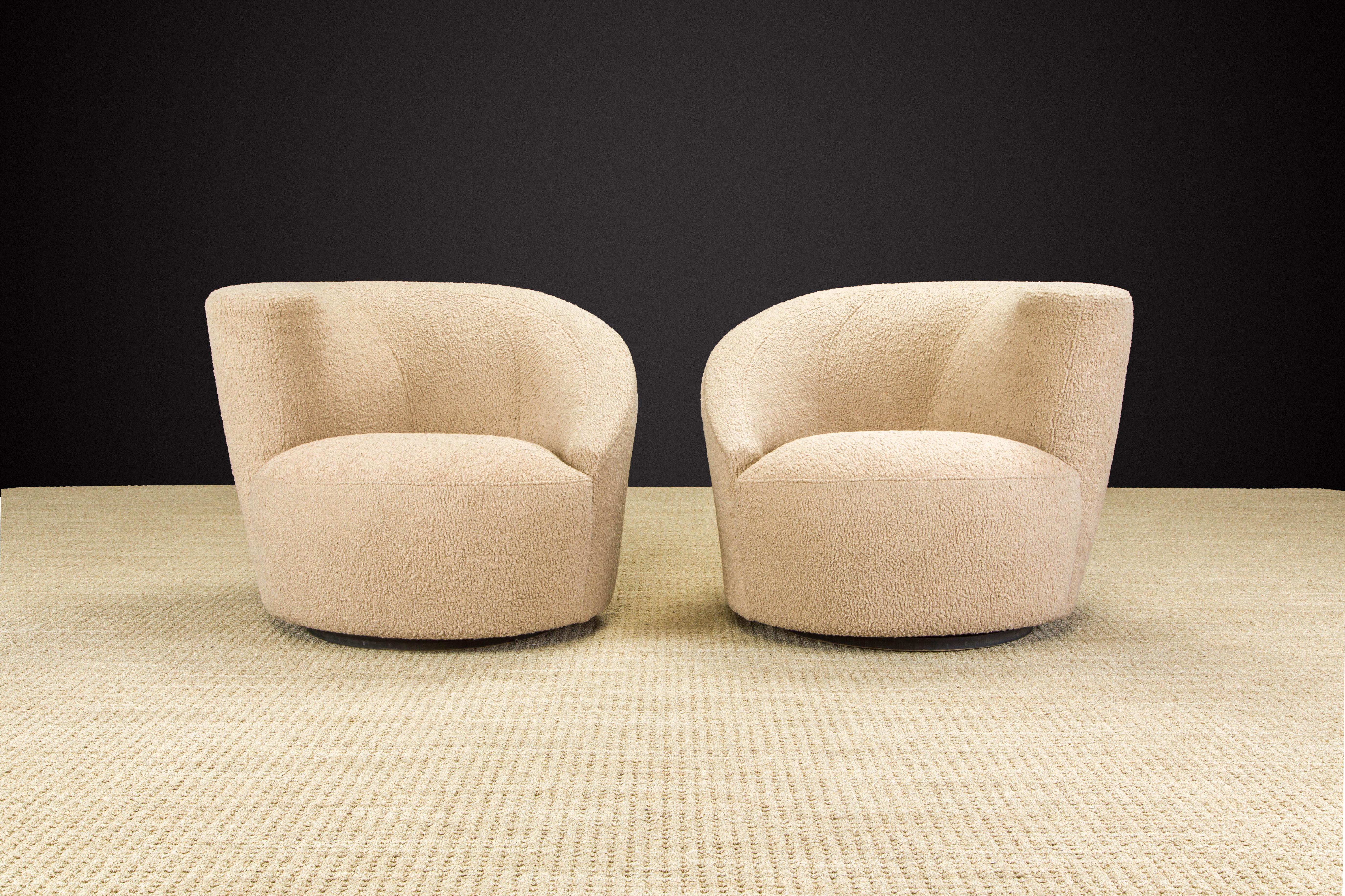 Newly reupholstered in a soft and nubby beige bouclé, this pair of 'Corkscrew' swivel chairs, also often referred to as 'Nautilus', by Vladimir Kagan for Directional, circa 1980 is signed with a Directional label underneath. These classic club