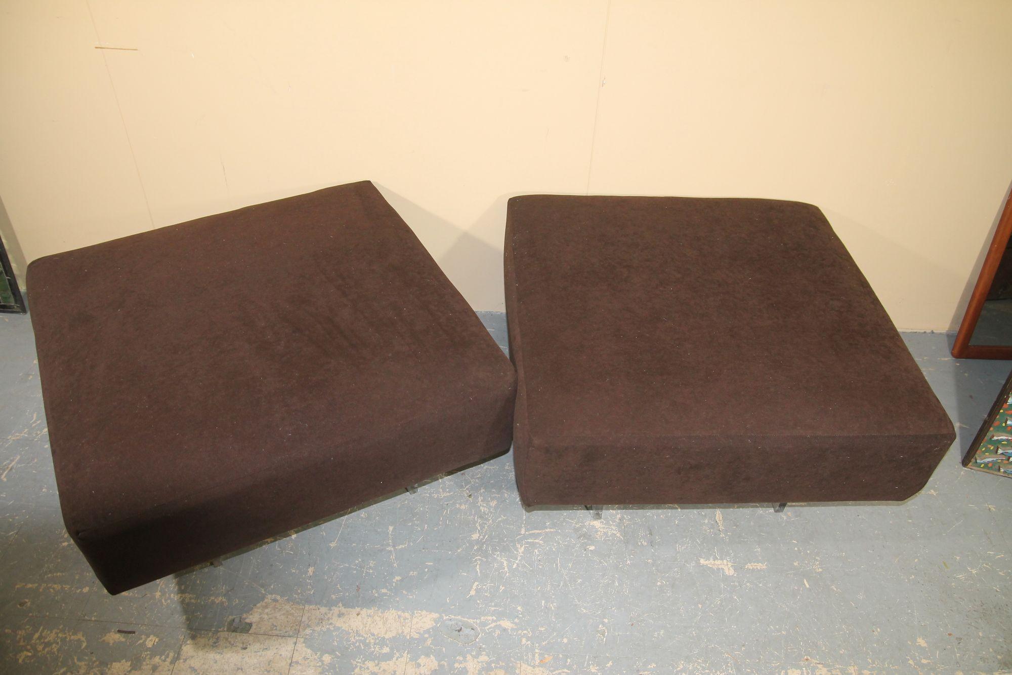 Pleased to offered this great pair of ottomans by Vladimir Kagan. This oversized ottomans will look perfect in any decor. Fabric can be used as is or these are perfect for a redo in your own fabric. Lucite legs were professionally tighten.