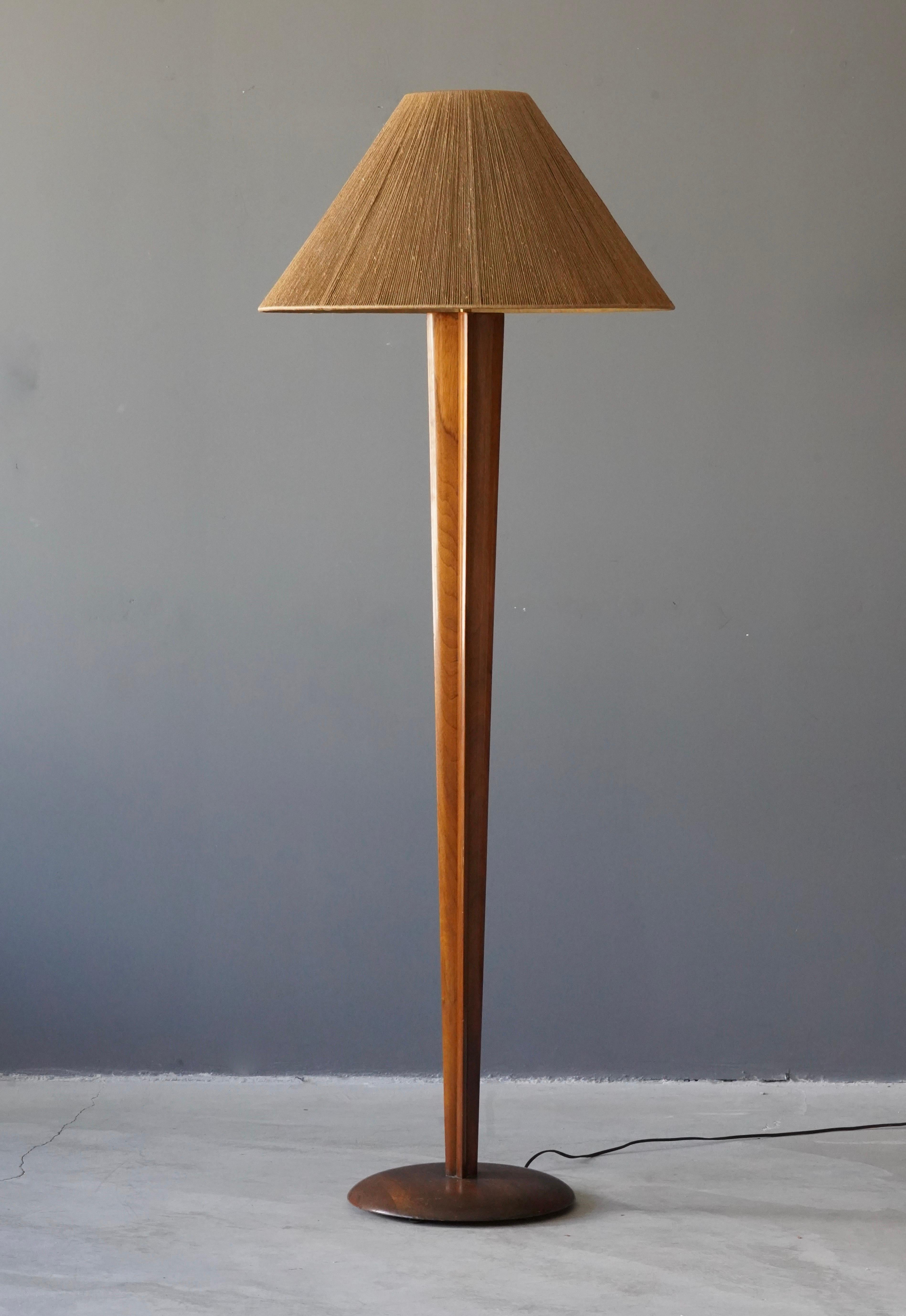 A rare floor lamp designed by Vladimir Kagan. Produced by Kagan-Dreyfus in New York circa 1960s. 

Rod and base is finely carved walnut. Bears its original oversized string shade. 

Other American designers of the era include T.H. Robsjohn