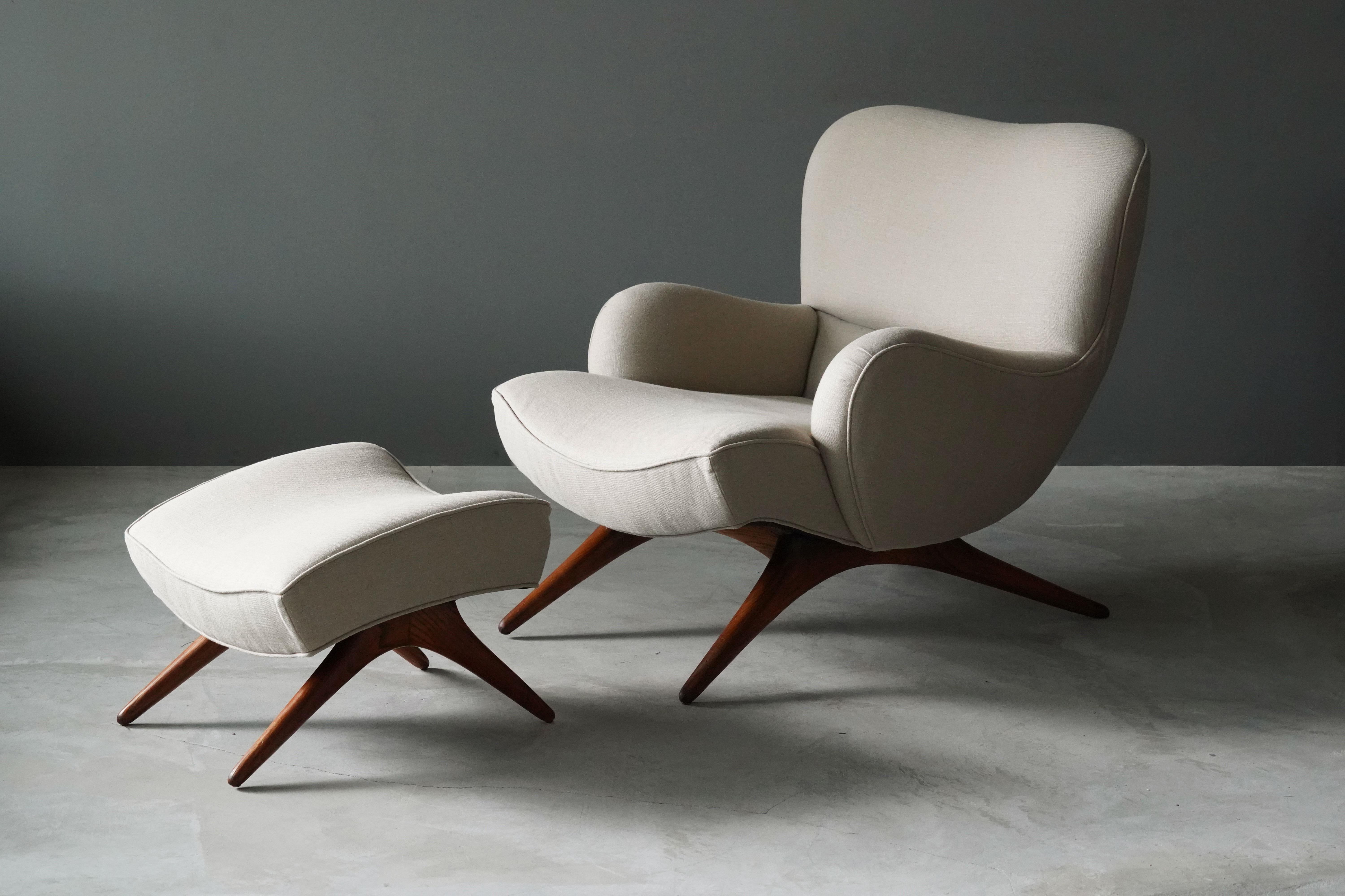 A rare early production lounge chair with ottoman. Designed by Vladimir Kagan for his own firm Kagan-Dreyfuss, Inc, c. 1950. 

Features finely carved ash, reupholstered at a recent point in time.