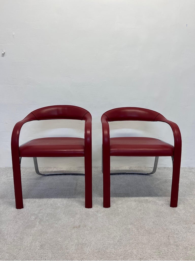 Pair of red leather and chrome Fettuccini chairs for Fasem, Italy.

The Fettuccini dining chair is a unique leather chair that is sure to garner attention. Vladimir Kagan designed the chair in 1997, adding to his iconic collection. Typical of