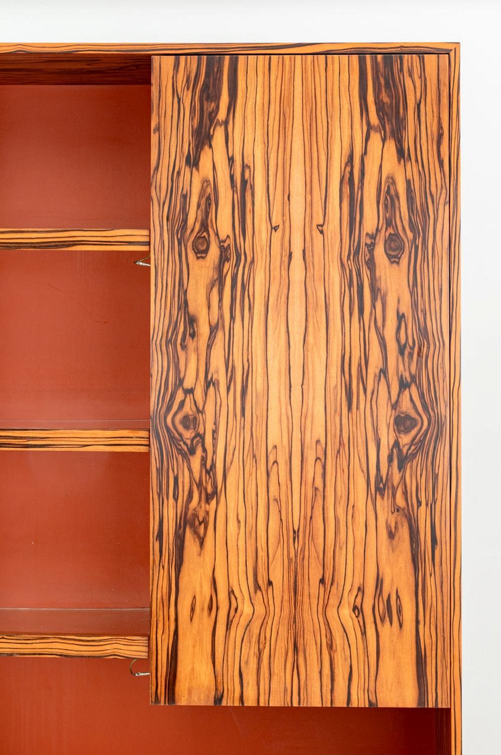 Vladimir Kagan Illuminated Rosewood Bar Cabinet, 1970, orange lacquered wood table between upper cabinet with acrylic shelves and lower two door cabinet. 92