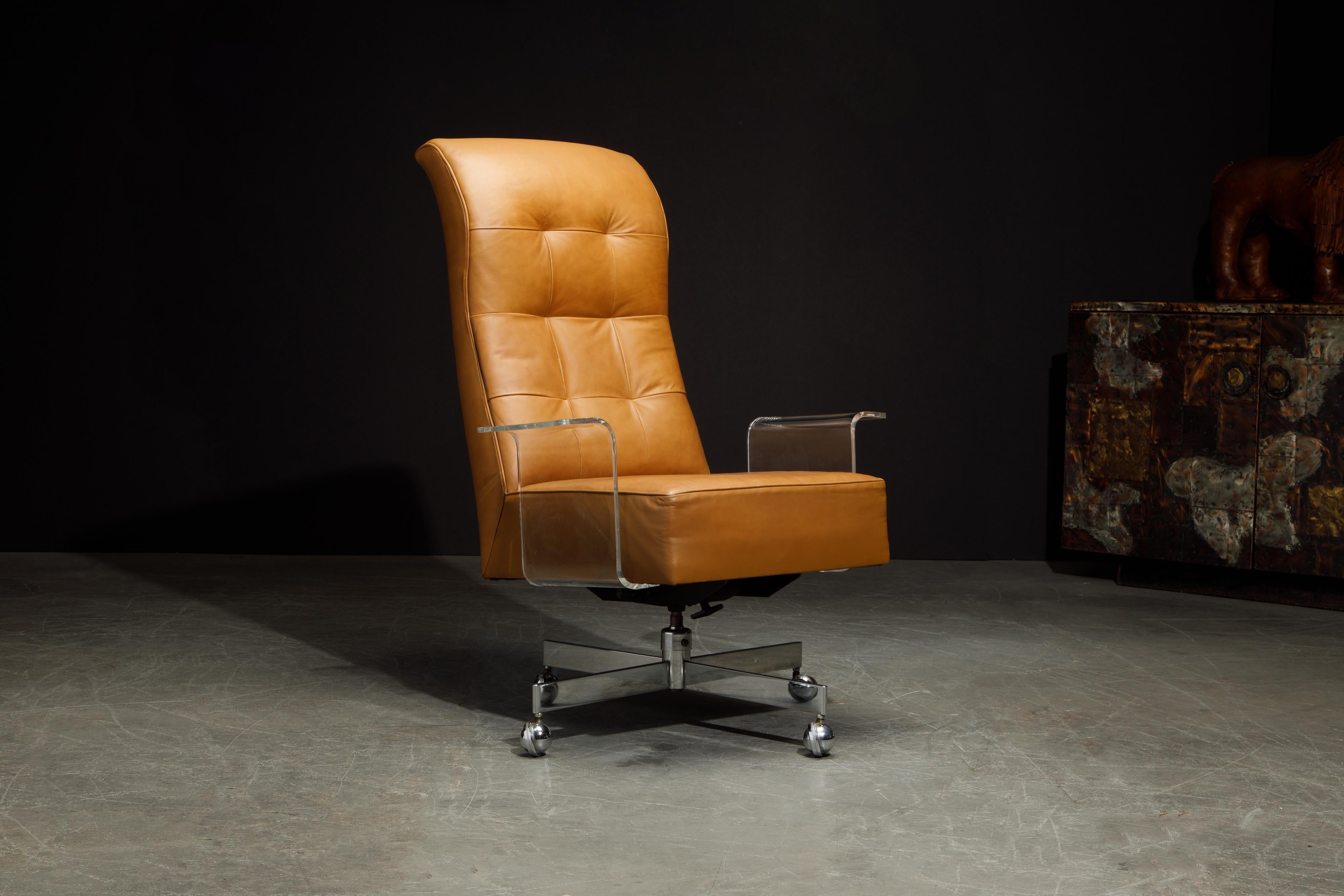 This stunning lucite, warm brown leather and chrome executive desk chair is by Vladimir Kagan for Vladimir Kagan Designs, circa 1970. This Kagan desk chair features swivel, recline, and height and tilt adjustment mechanisms. On a heavy polished