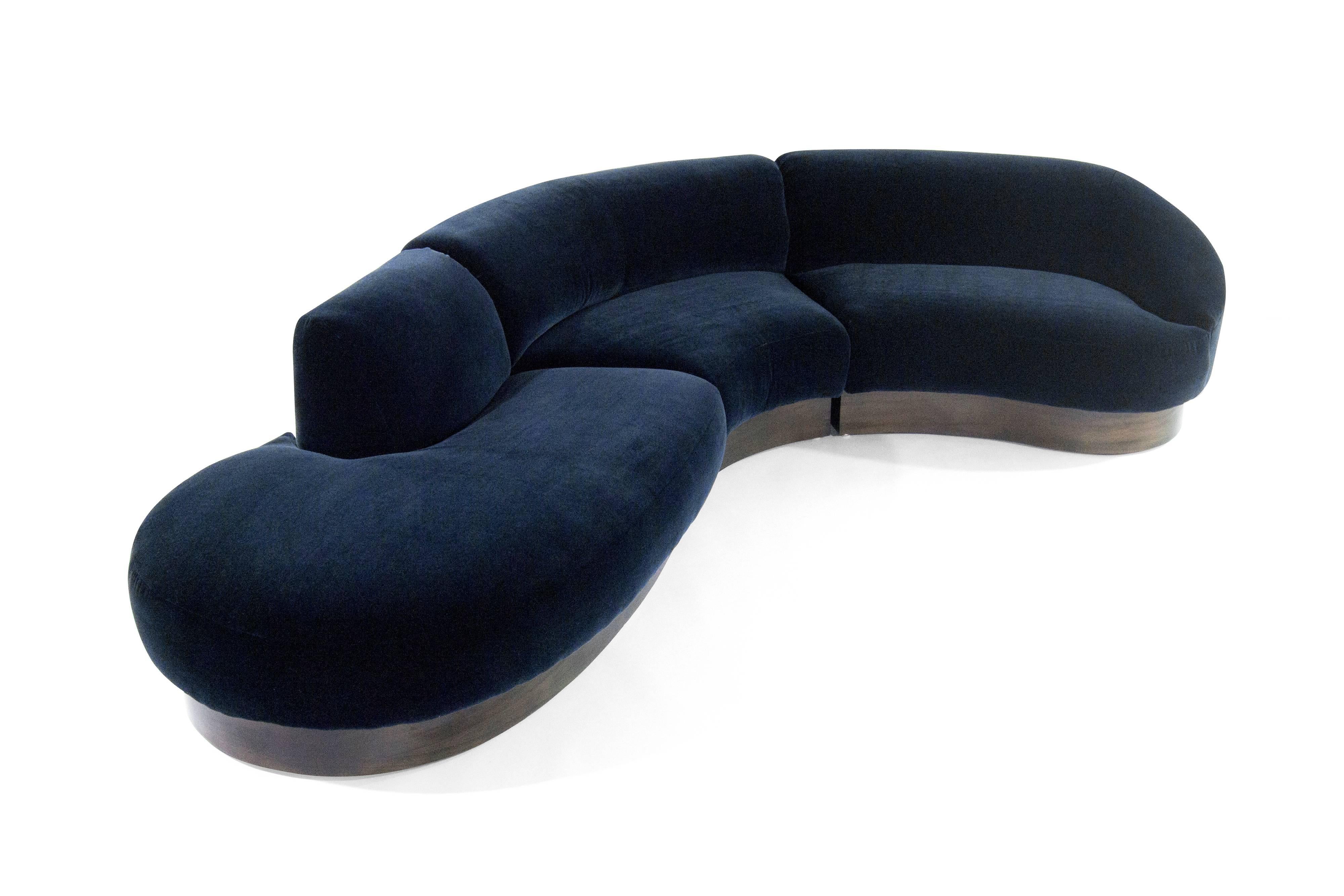 An extremely rare three-piece sectional sofa designed by Vladimir Kagan for Directional, circa 1970s. Newly upholstered in deep blue mohair by Donghia. Walnut bases fully restored.