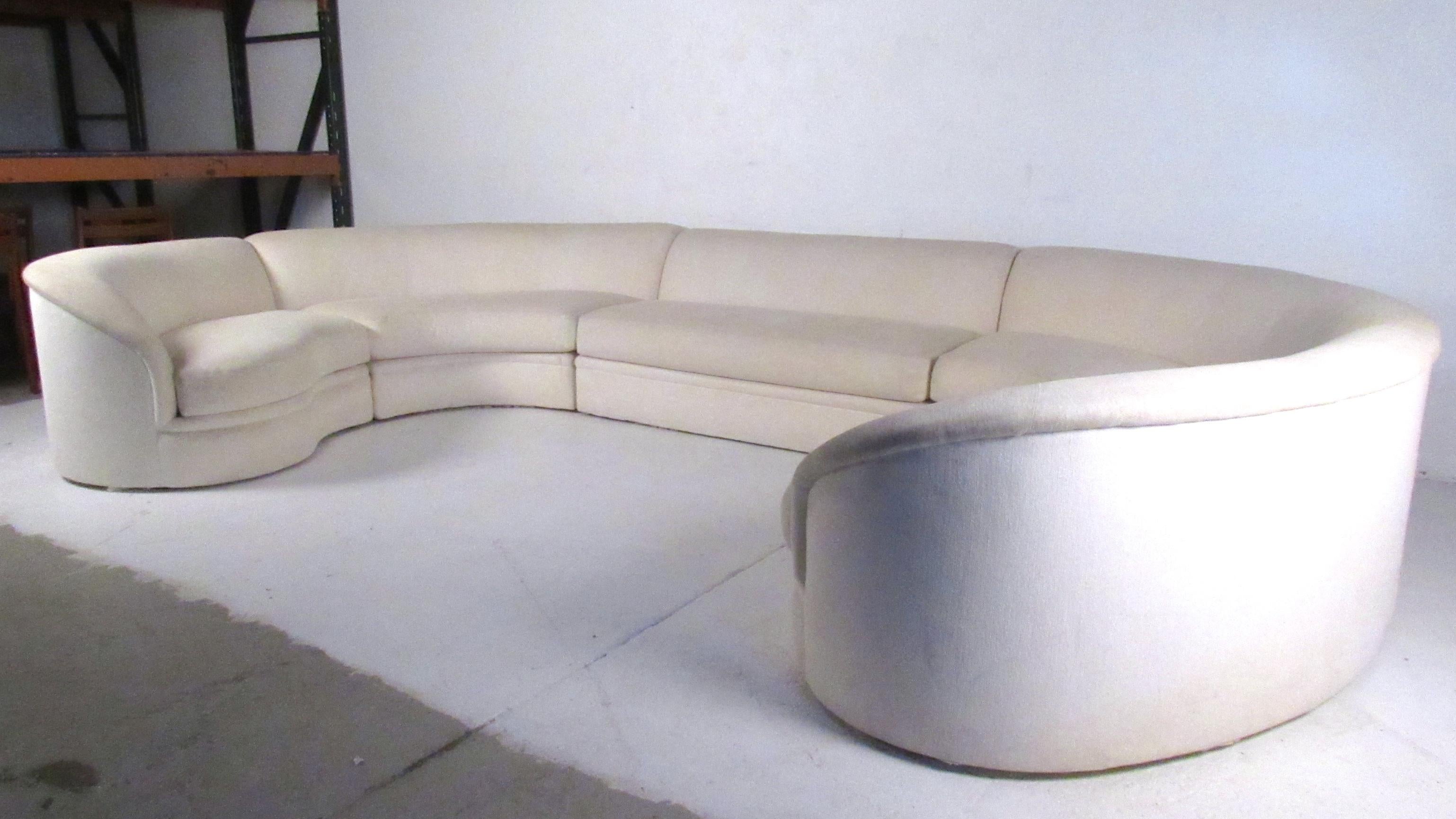 This stunning midcentury sectional sofa boasts striking modern design and makes an impressive sofa for spacious business or home seating areas. Designed for Directional by Vladimir Kagan the elegant simplicity of the piece combines comfort and