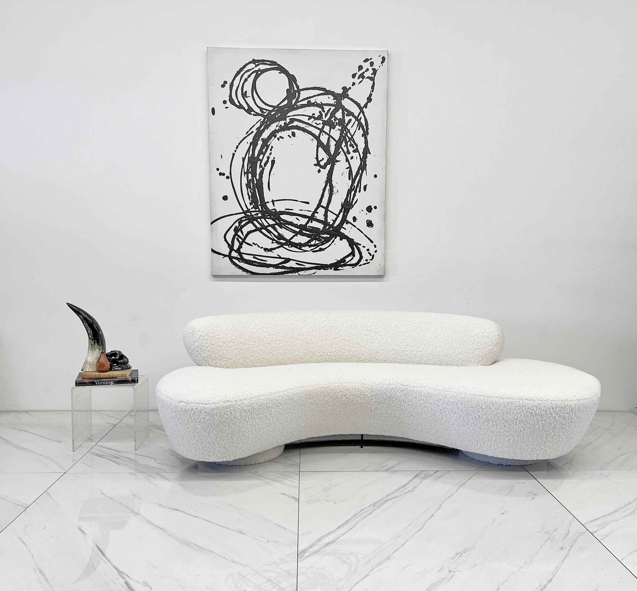 Let’s be real: this Vladimir Kagan sofa is an absolute dreamboat. Fully wrapped in a rich, ivory bouclé (yes, even that sexy double-disc base), it’s basically a cloud you can splay out on. Heavily textured, gloriously sculptural, and cozy enough to