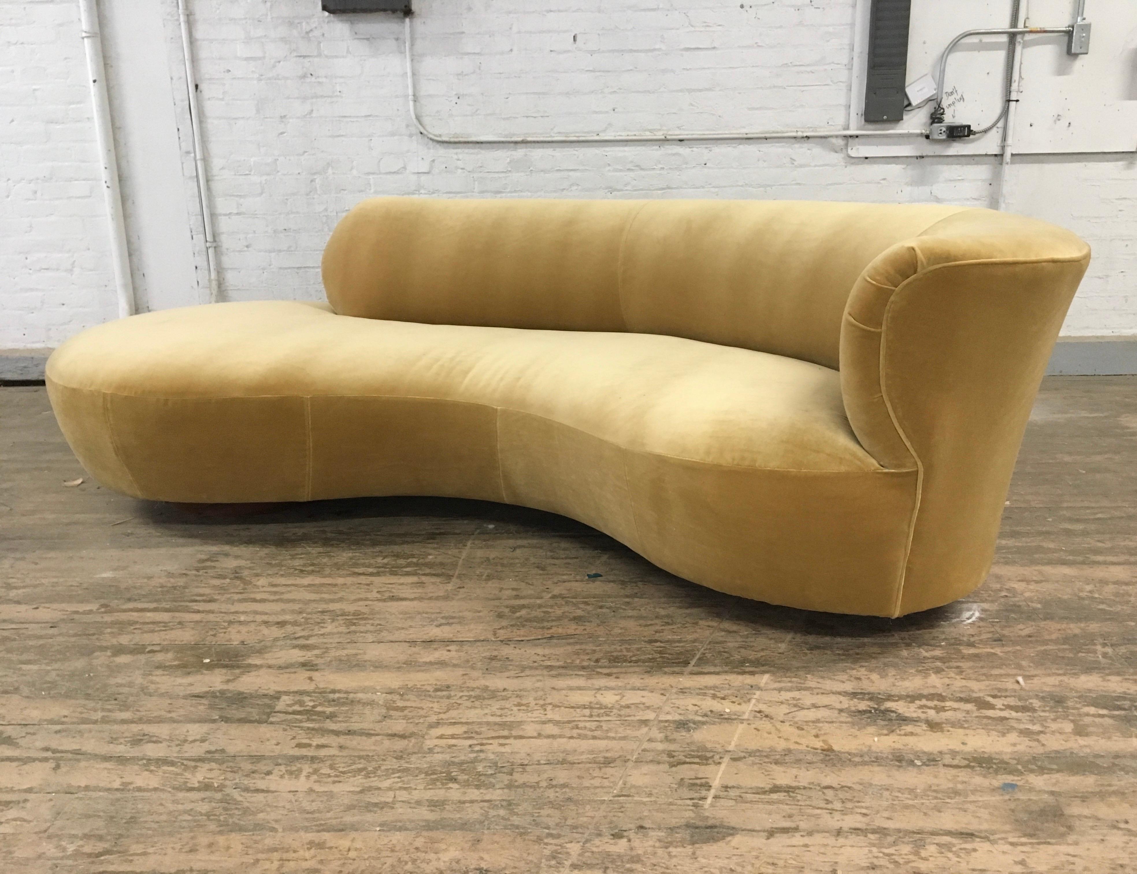 Serpentine sofa attributed to the late Vladimir Kagan. Upholstery is replaced in a Camel velvet.