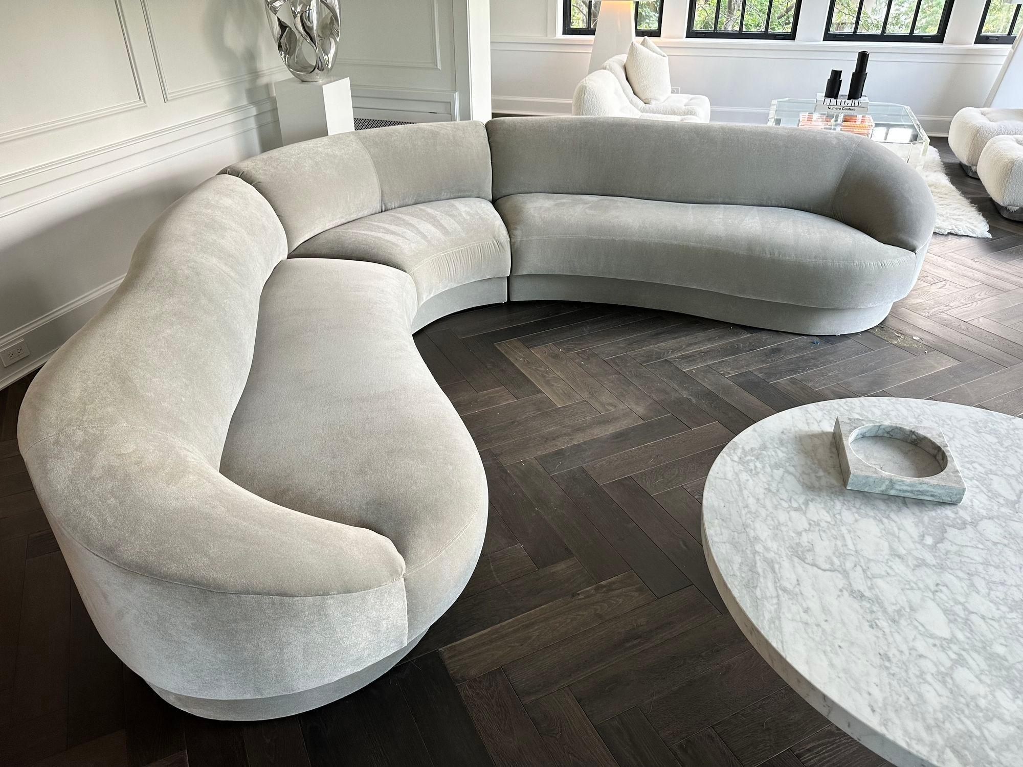 Vladimir Kagan Serpentine Sectional Sofa from the 1990's. Reupholstered in gray velvet
Measures End sections 88