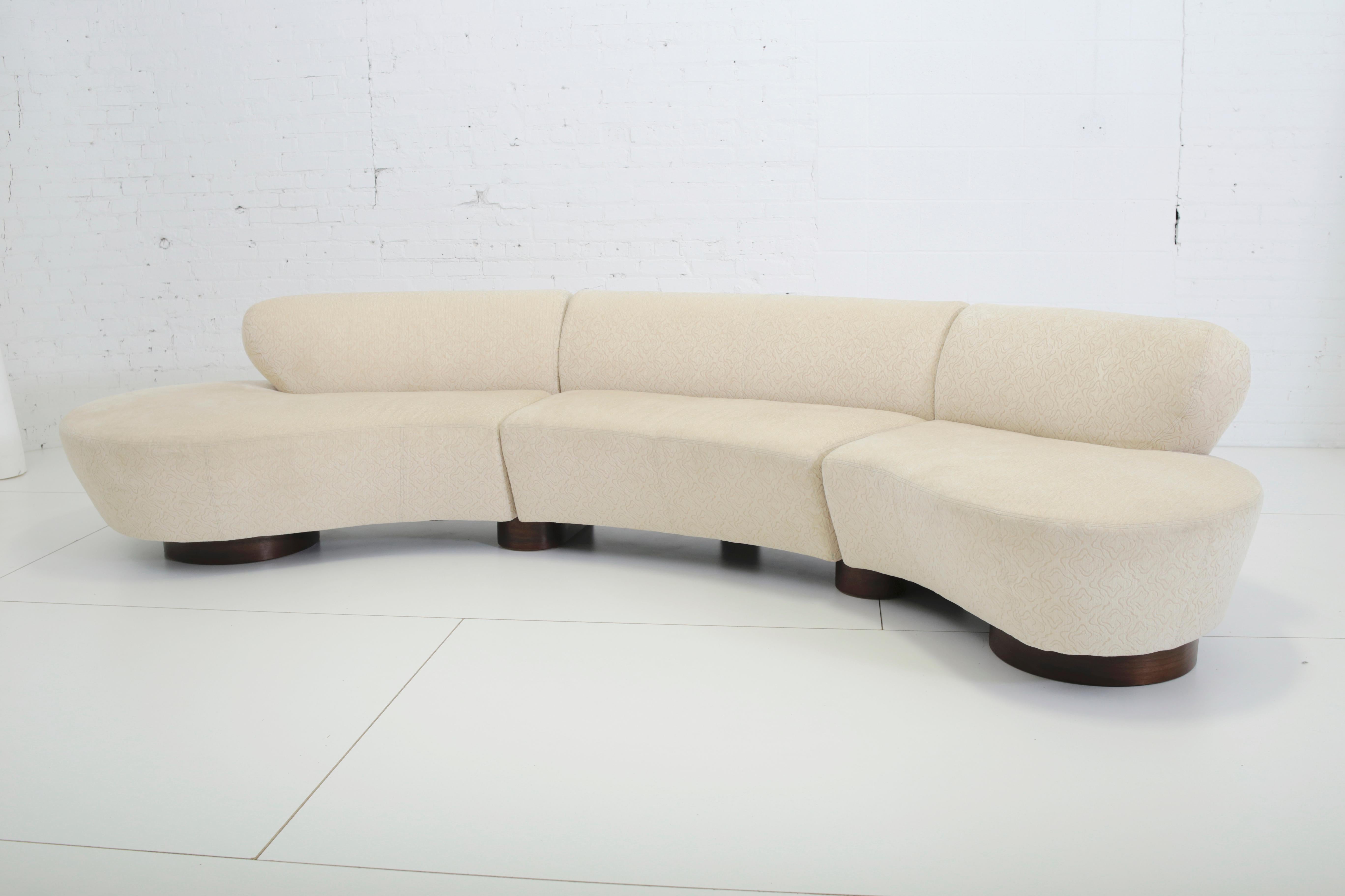 Three-piece sectional sofa designed by Vladimir Kagan for Directional. Original fabric on walnut bases.