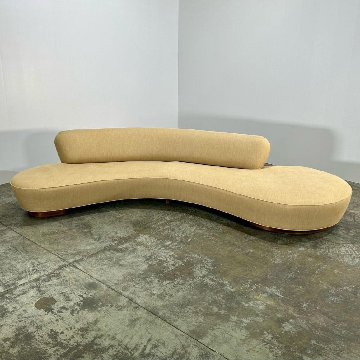 Introducing the stunning Serpentine Sofa by renowned designer Vladimir Kagan. This luxurious piece features a unique curved design that exudes elegance and sophistication. Crafted with the highest quality materials, including a sturdy wooden frame