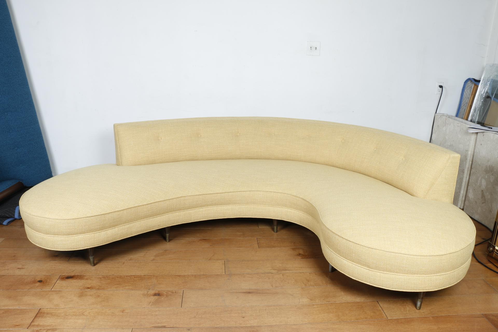 Beautiful unique Vladimir Kagan Serpentine shaped sofa. Has been reupholstered in a vintage light hellos fabric. No damages or rips. Sitting on vintage strong legs. Great accent piece for any living room or space. Gorgeous style sofa that can sit