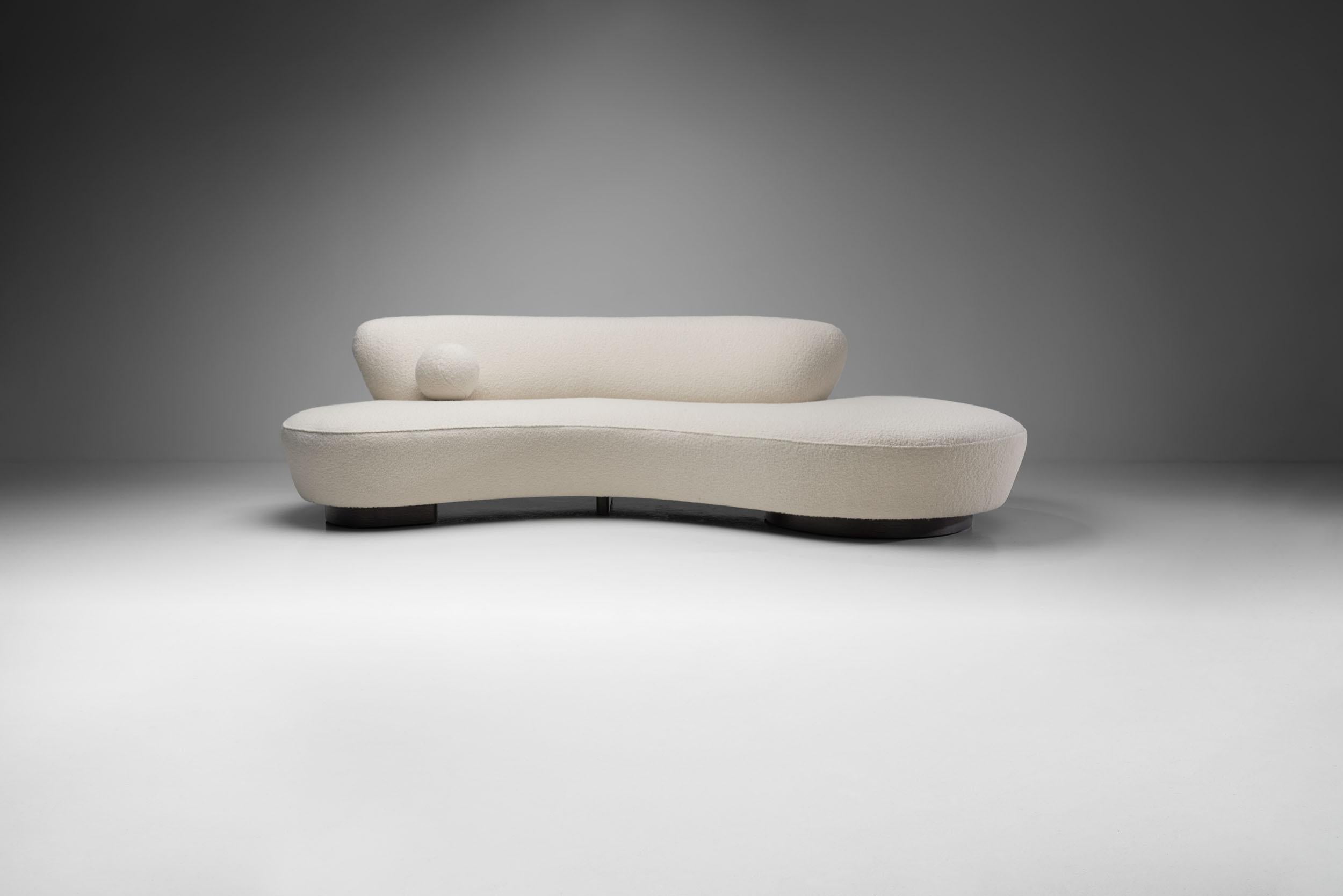 This is a beautiful “Model 150BS” sculptural sofa by the world-famous designer, Vladimir Kagan. This sofa shows Kagan’s skill to fuse sleek design with the trappings of comfort.

With a clean white bouclé fabric upholstery, this Serpentine soda