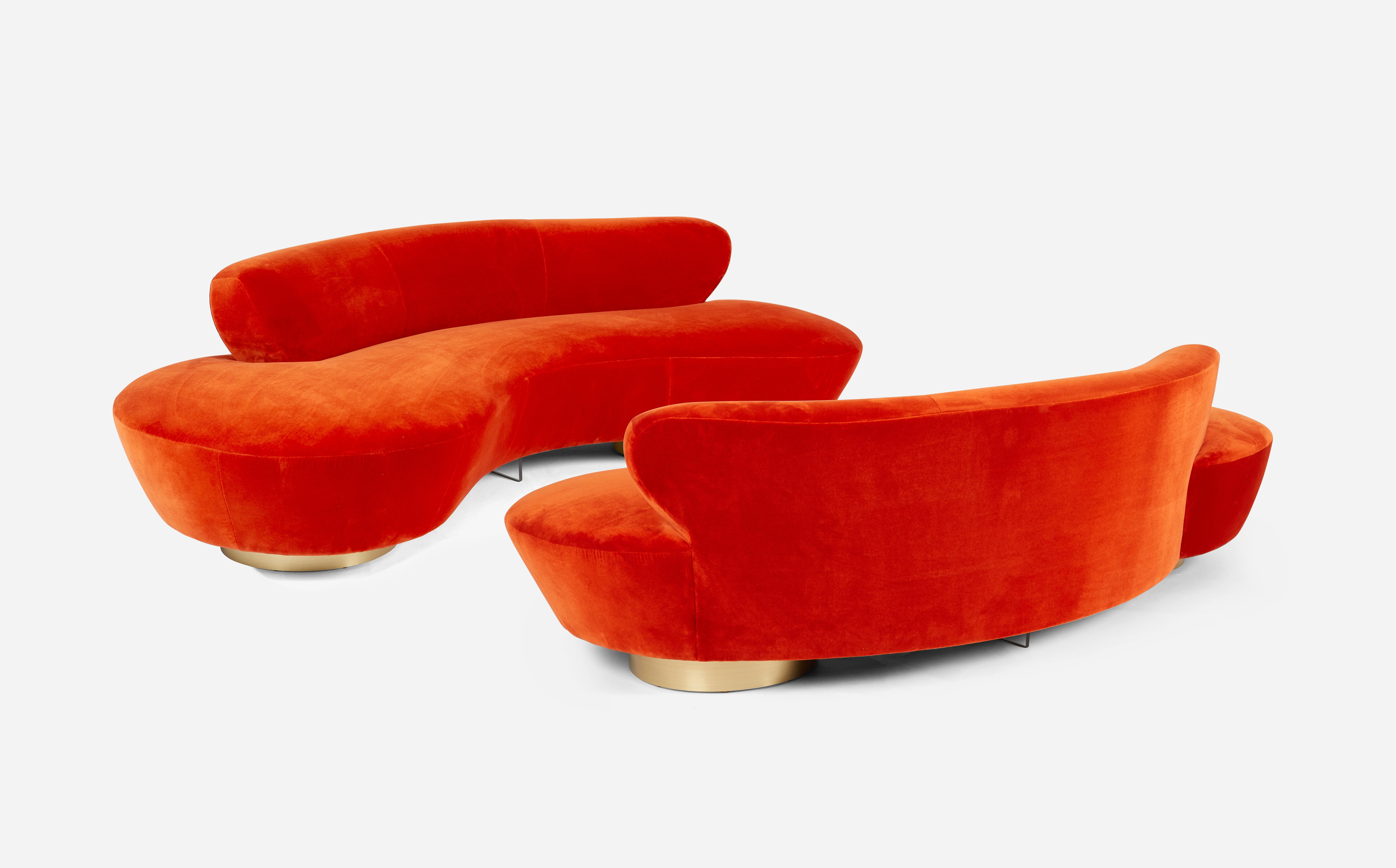 Pair of serpentine sofas designed by Vladimir Kagan for Directional Furniture. Fully restored and reupholstered in vibrant coral velvet.