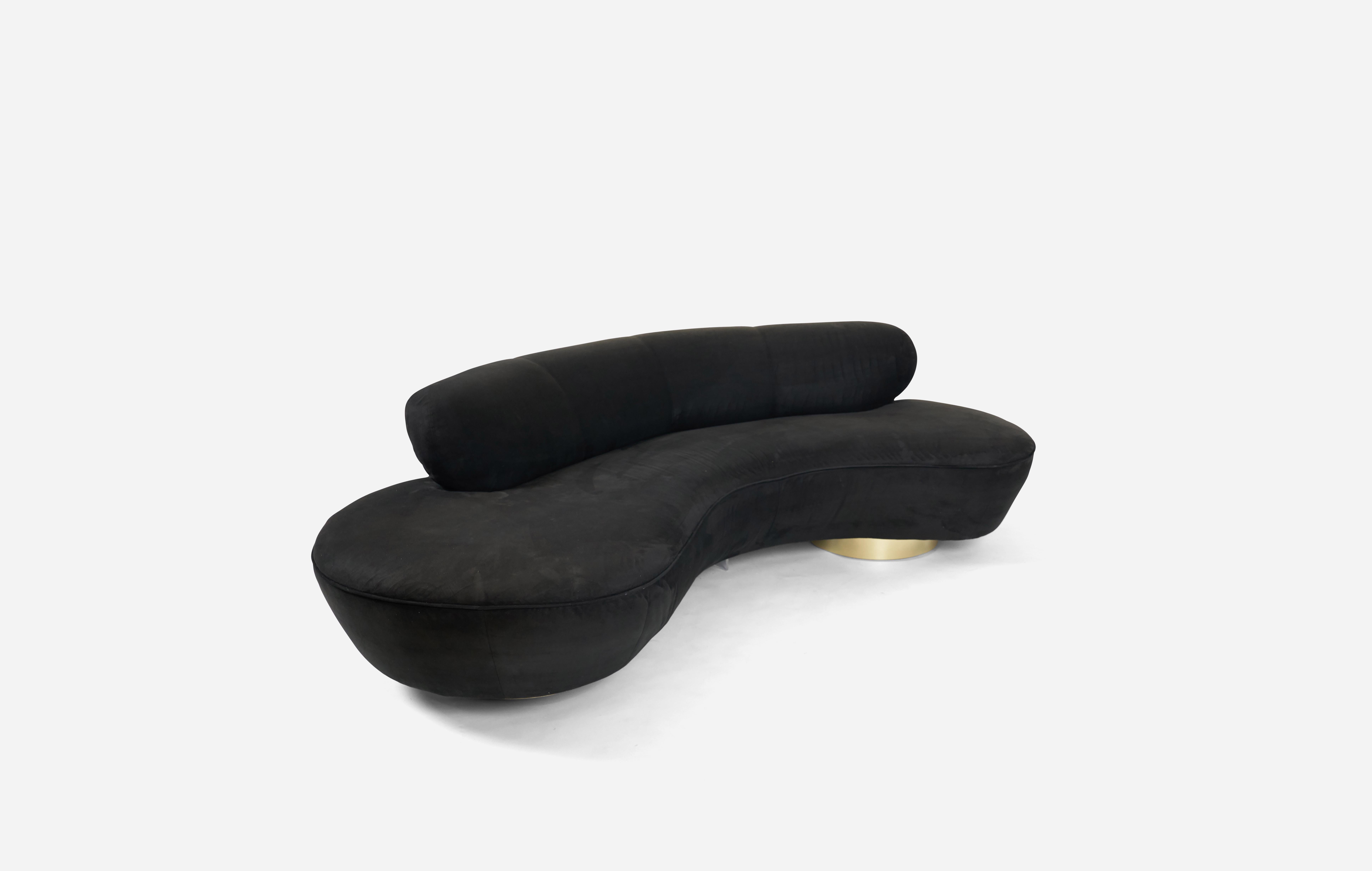 Pair of serpentine sofas designed by Vladimir Kagan for Directional Furniture. Original black micro velvet upholstery over brass bases. Original fabric shows some fading.
 
