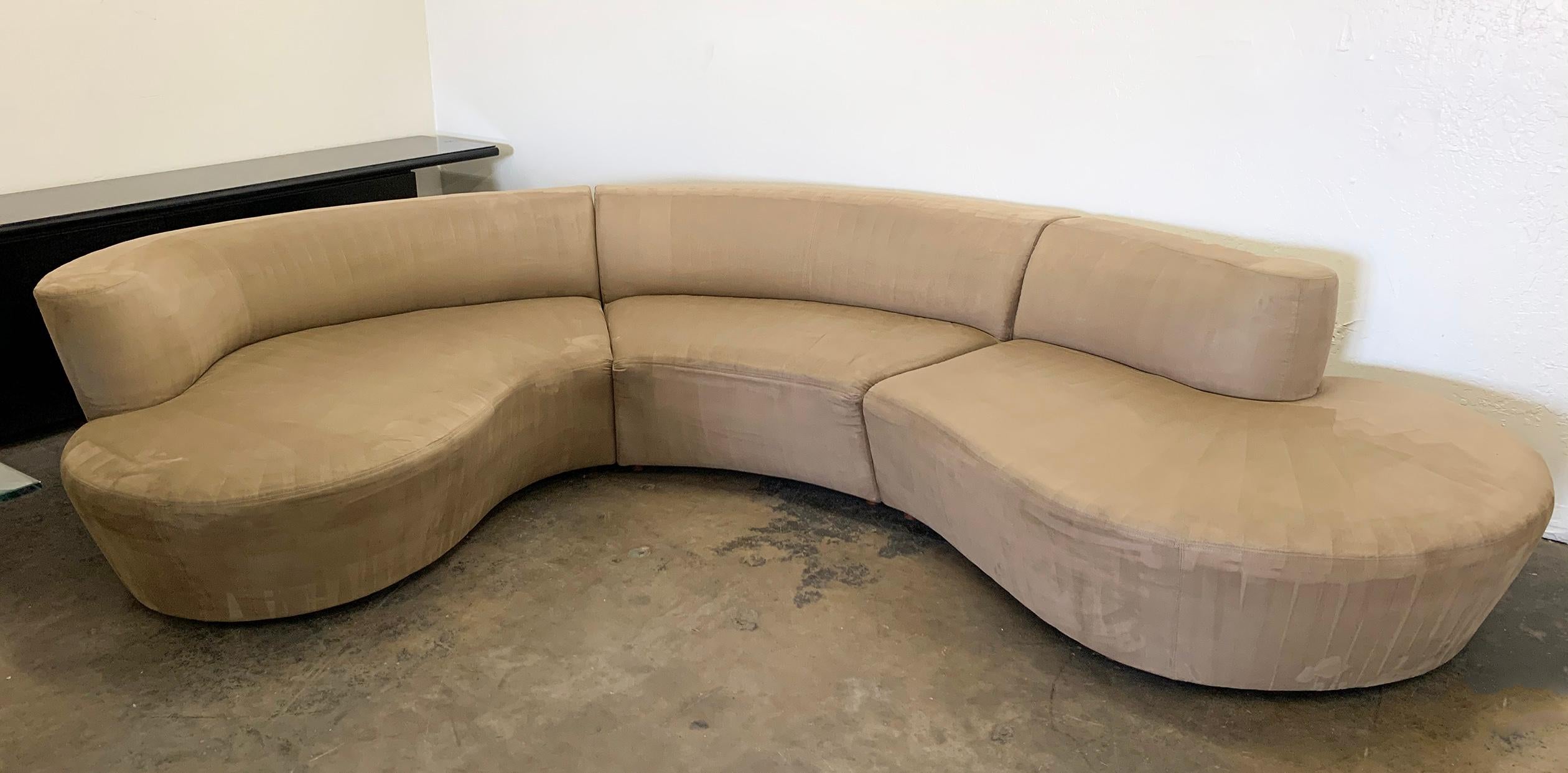 An absolutely gorgeous Vladimir Kagan serpentine sofa for Weiman. This three piece sectional is upholstered in a tan / taupe colored microsuede and is good condition with minimal wear consistent with age and use.

This sofa, like every other sofa