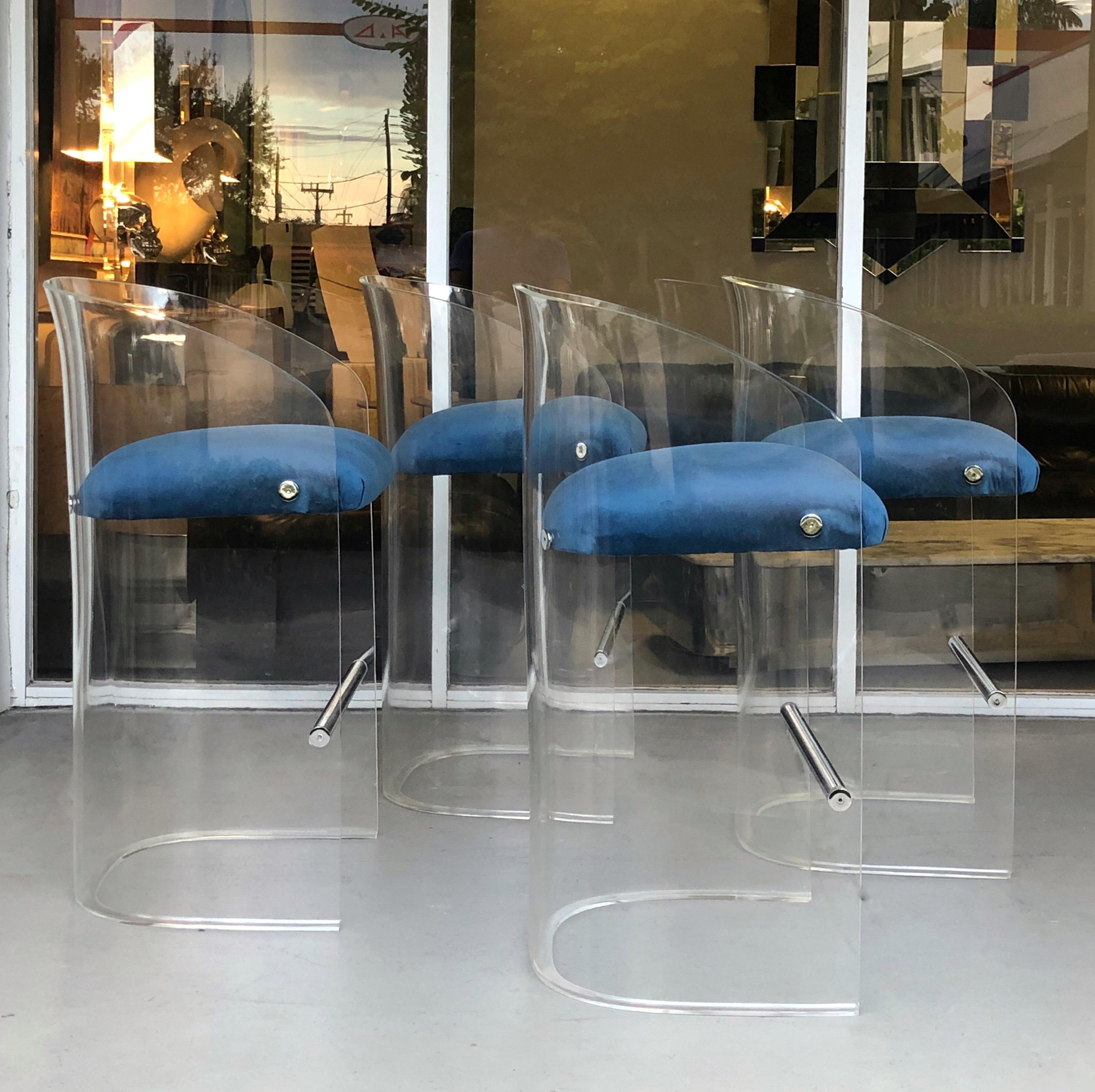 A set of 4 Lucite barstools by Vladimir Kagan. Very pure lines. Virtuoso clean and simple design. From a mid-1970s interior by Michael Desantis.