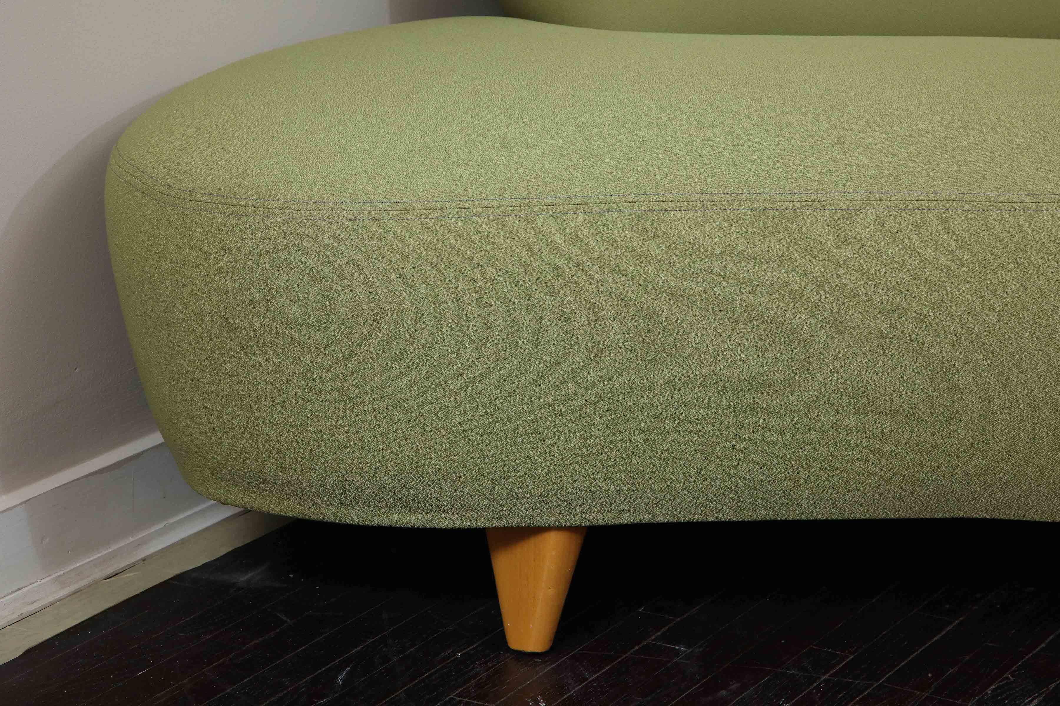 Vintage Vladimir Kagan sofa for Modernica from 1970s. A dynamic and iconic sofa piece that is in the original green lime fabric with 6 tapered wooden legs. Refinishing and reupholstery can be done with COM (Customer Owned Material) by request.