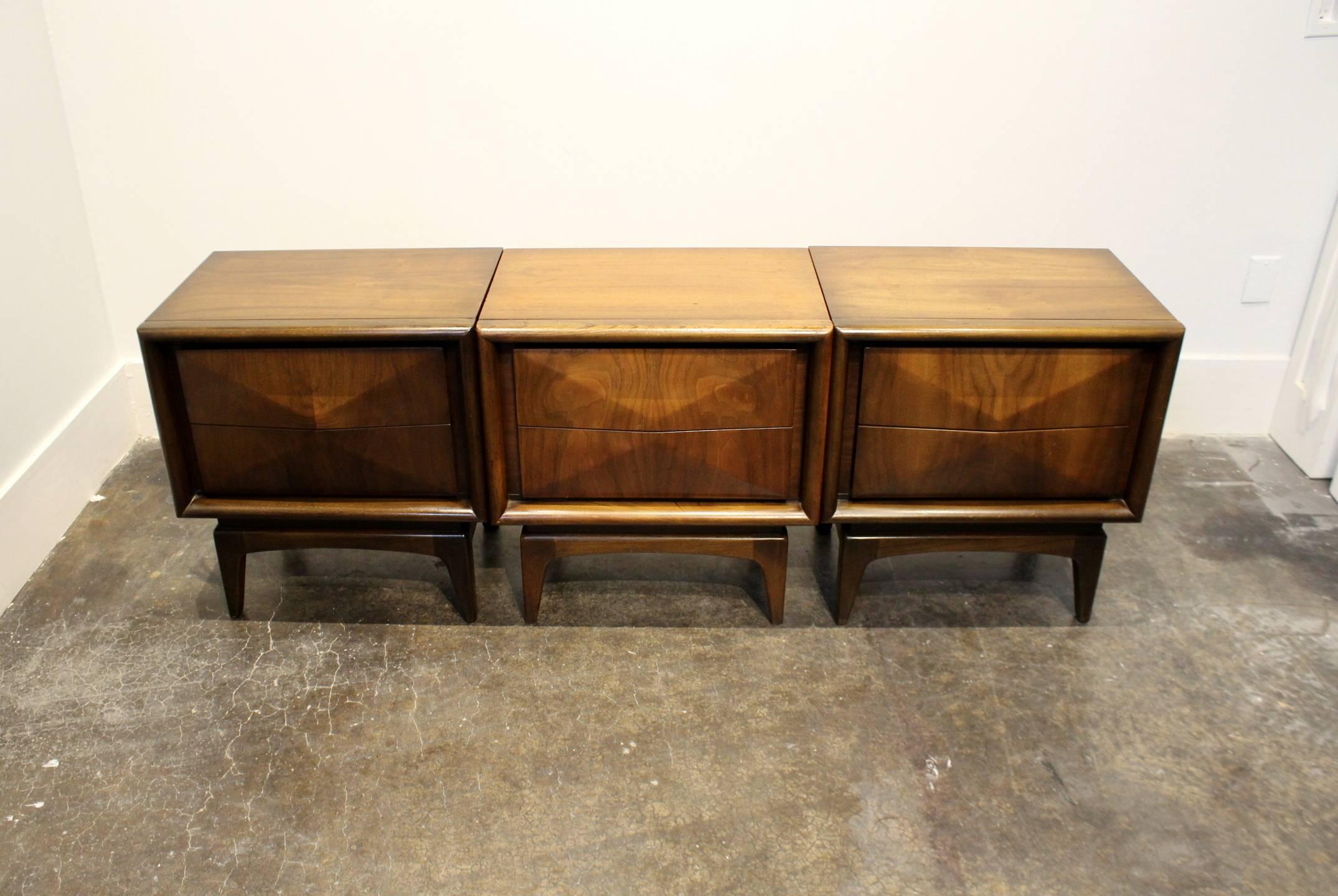 One of the most iconic designs of the era! Beautiful diamond-shaped front with two bevelled drawers, glowing walnut wood, tapered feet. Selling individually or as a lot. Buy one to complete a pair or all three to make a modular dresser.