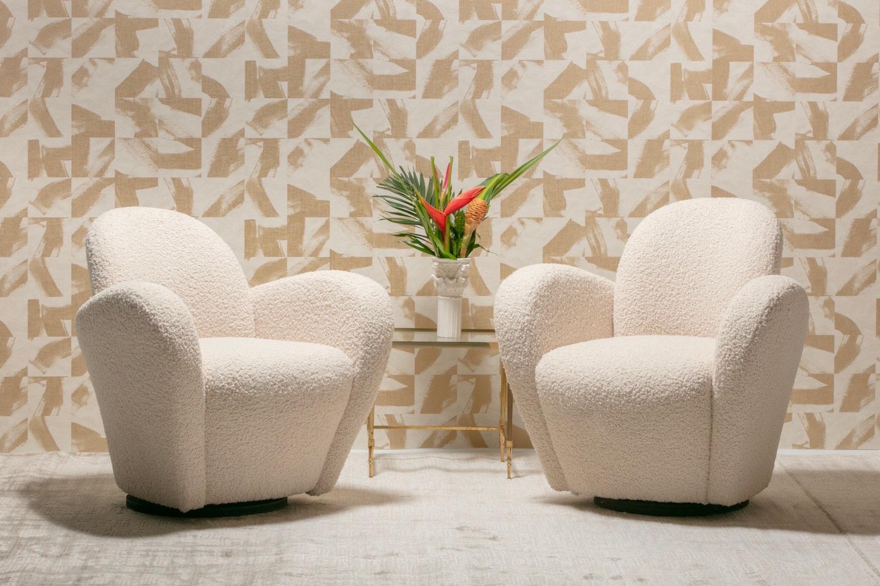 Sexy pair of Michael Wolk Miami chairs with swivel bases and en-suite ottoman professionally reupholstered in luxurious ivory bouclé. Frequently mistaken as designed by Vladimir Kagan, these Michael Wolk Miami chairs are iconic and were most