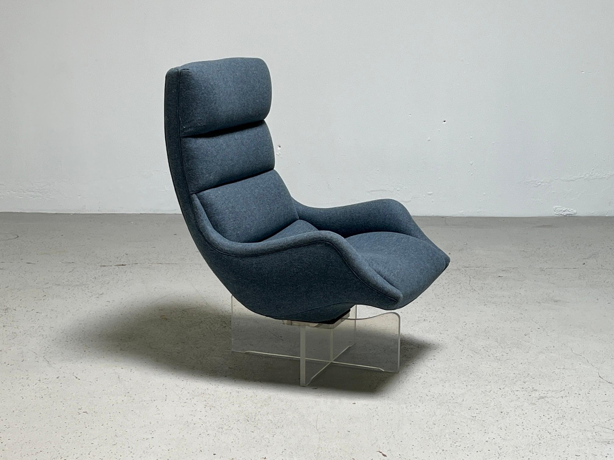 A beautifully restored Cosmos swivel chair on lucite base. Designed by Vladimir Kagan.