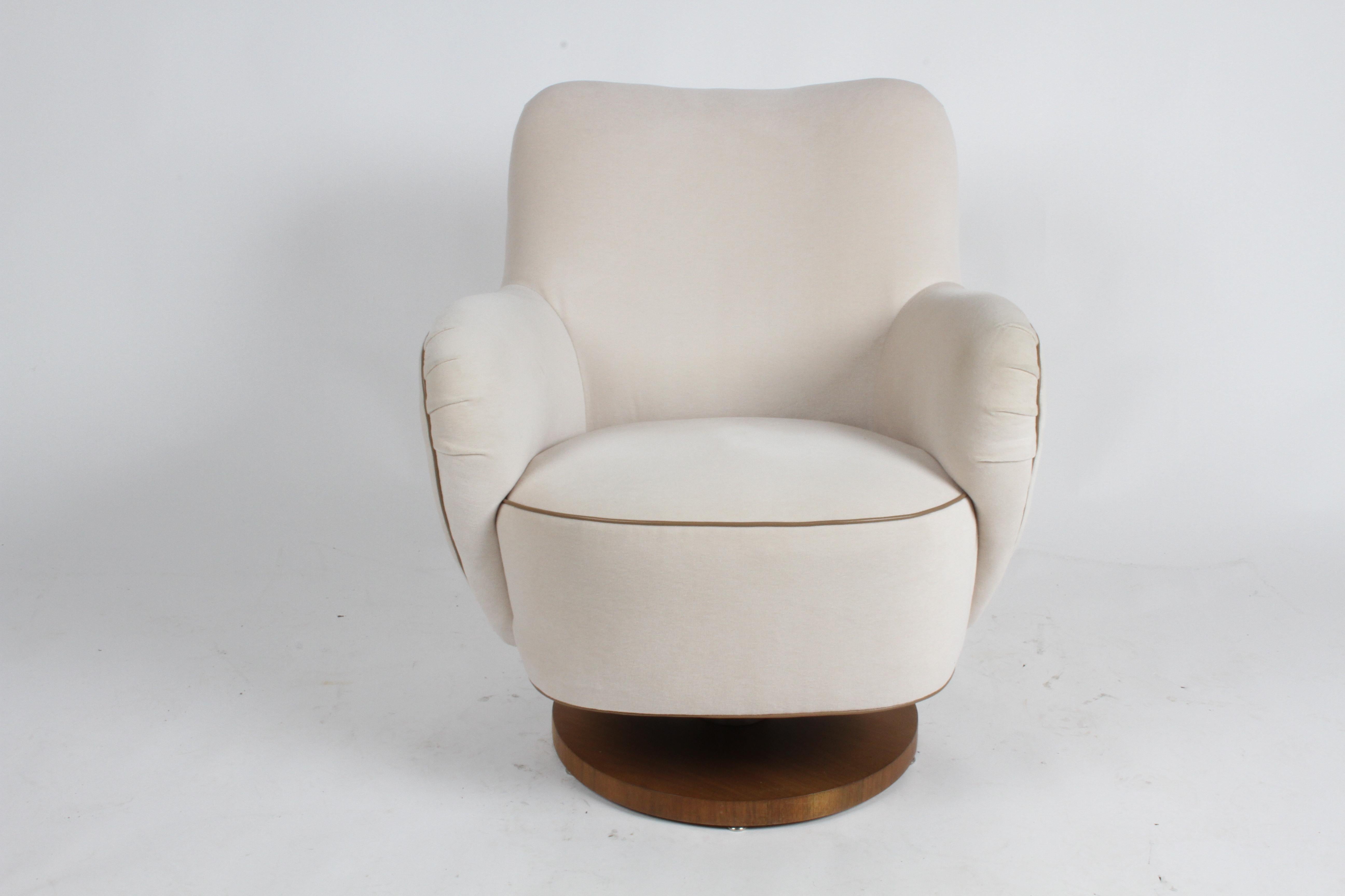 Vladimir Kagan barrel lounge chair model 100-S with tilt and walnut wood base. It was reupholstered in 2017 using Great Plains [Holly Hunt] “Next Generation – Winter White” [1607/01], which is 50% wool, 30% alpaca, and 20% silk. The contrast leather