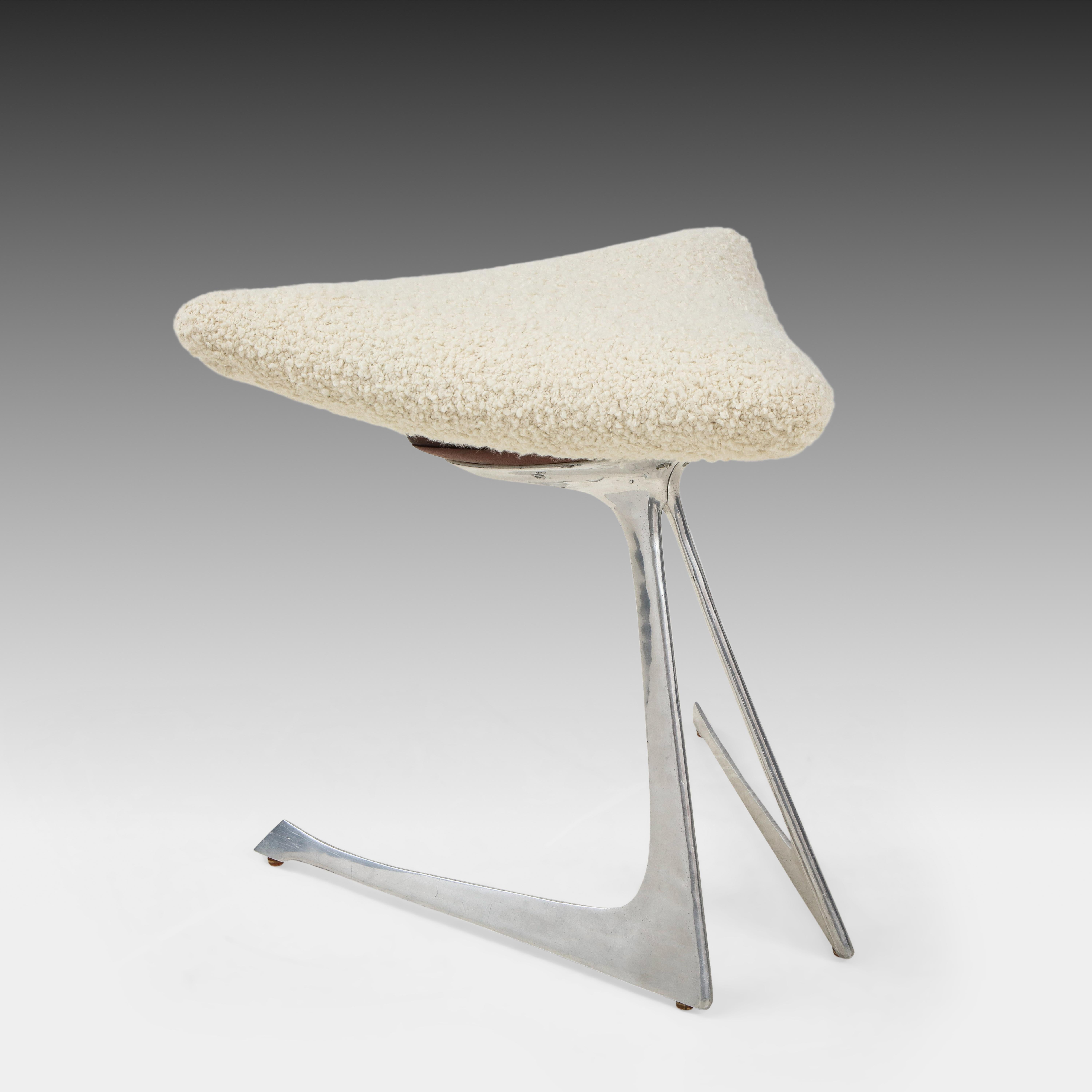 Vladimir Kagan for Vladimir Kagan Designs, Inc. very rare Unicorn triangular stool with ivory bouclé upholstered cushion on cast and polished aluminum base. Newly reupholstered in a luxurious Rosemary Hallgarten ivory or white alpaca wool