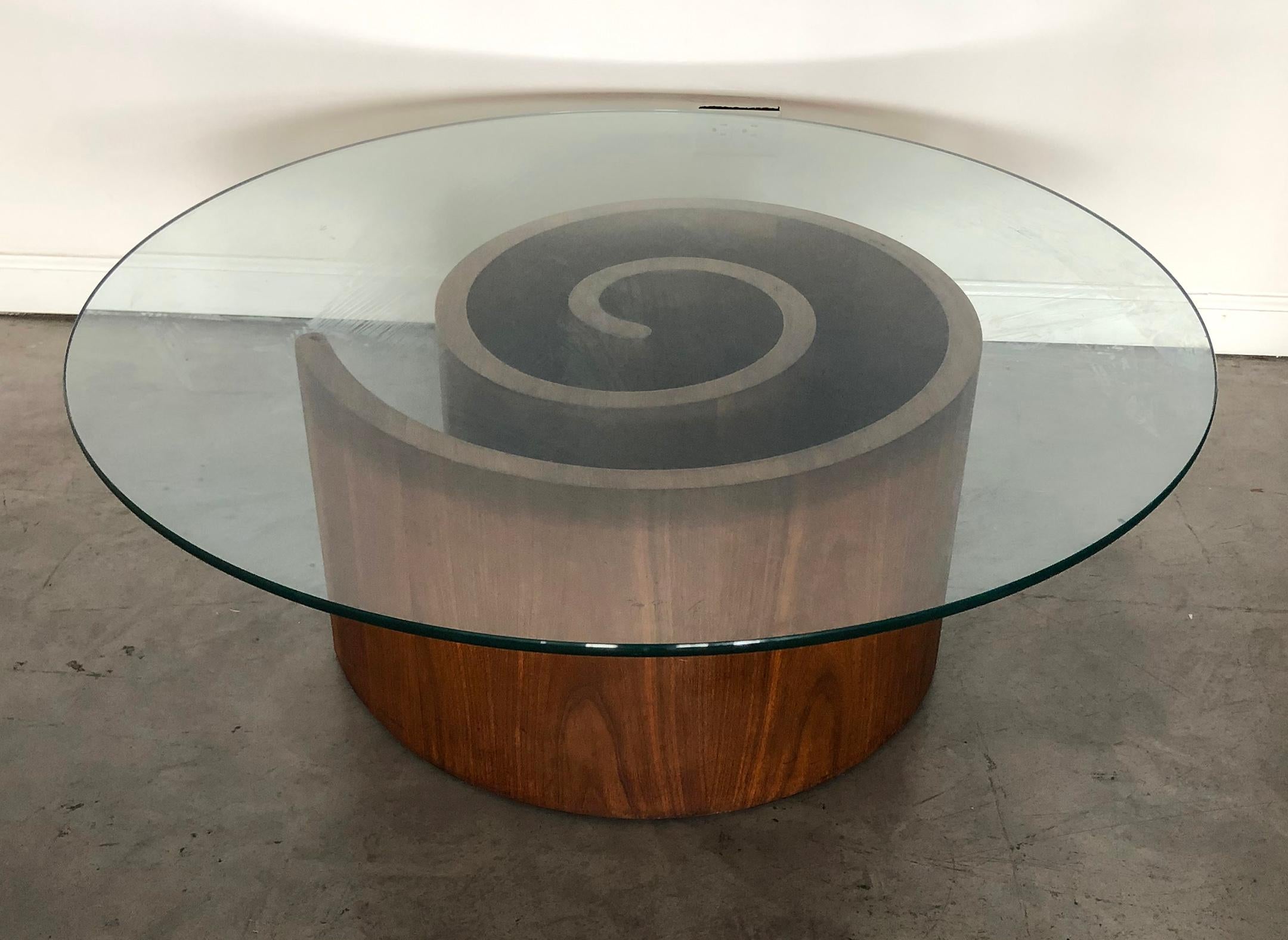 Available right now we have a stunning Vladimir Kagan Snail coffee table. This 
