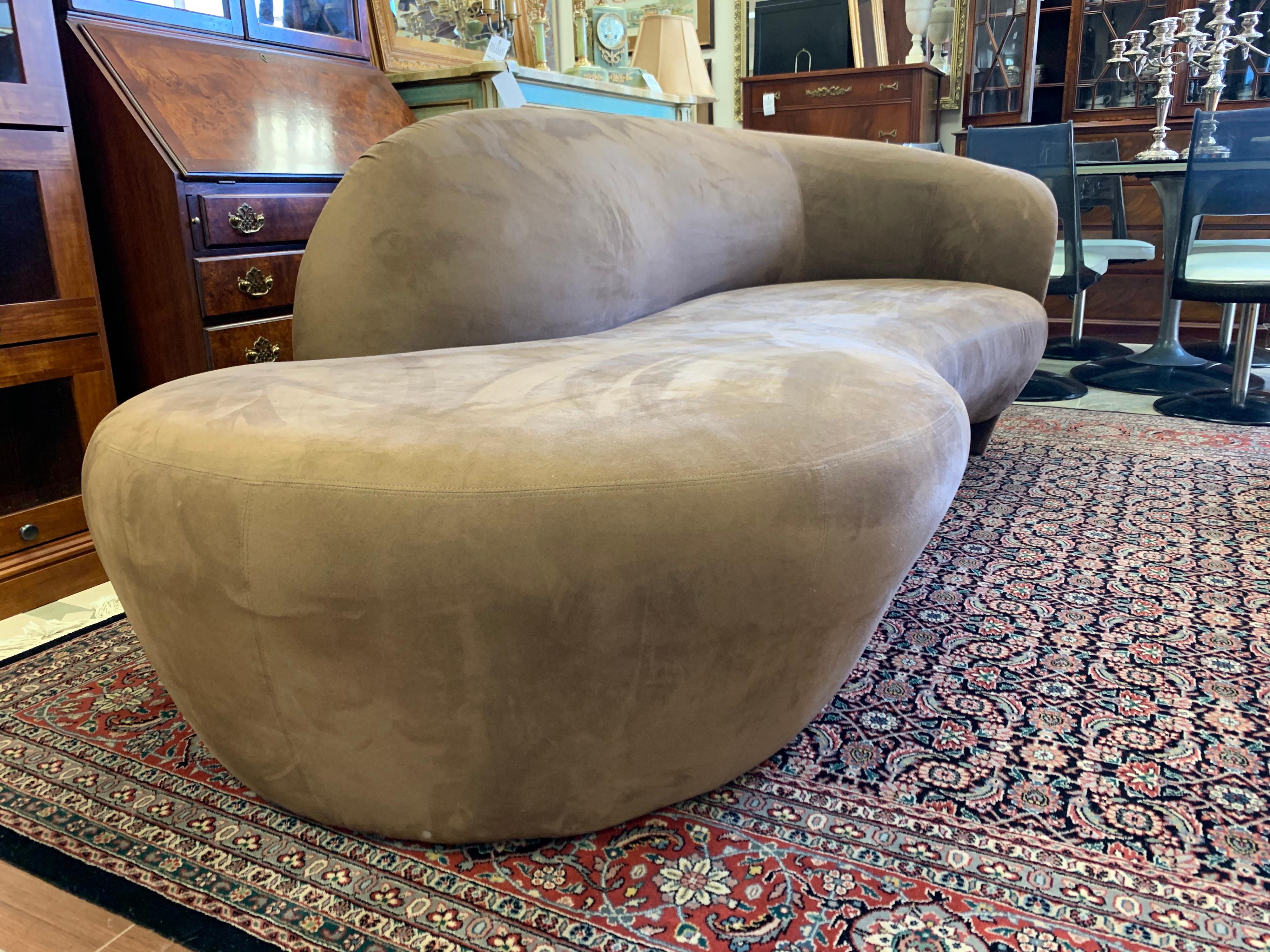 Magnificent Vladimir Kagan chocolate brown suede chaise lounge sofa. The brown suede fabric was done
eight years ago and is in very good condition except for two pin holes near edge of front of seat,  see pic. One of the most comfortable sofas you