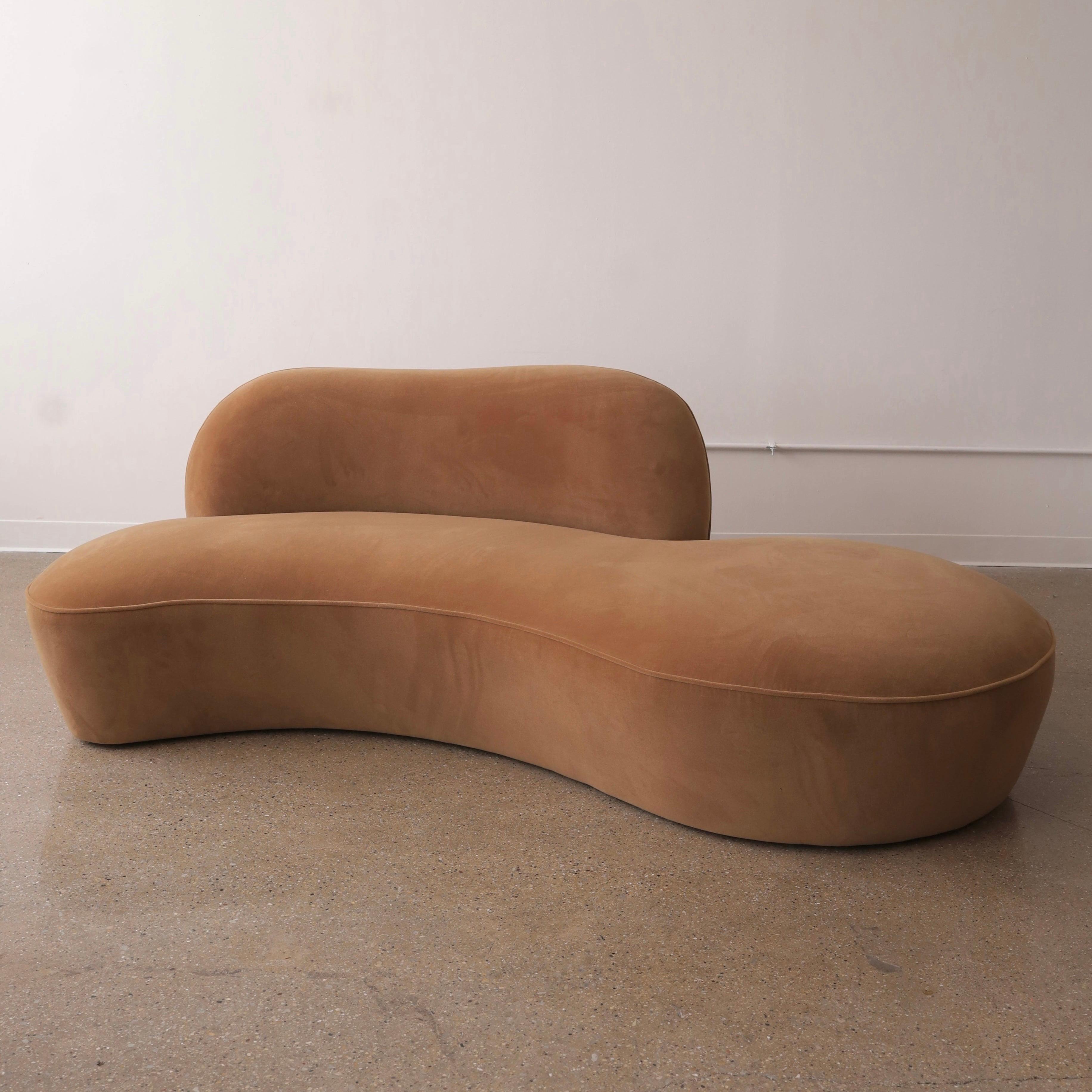 fully restored in a high pile, wool velvet and in excellent condition. This sofa features an organic profile and the appearance of a low sofa while overall maintaining the seat height of a traditional sofa
