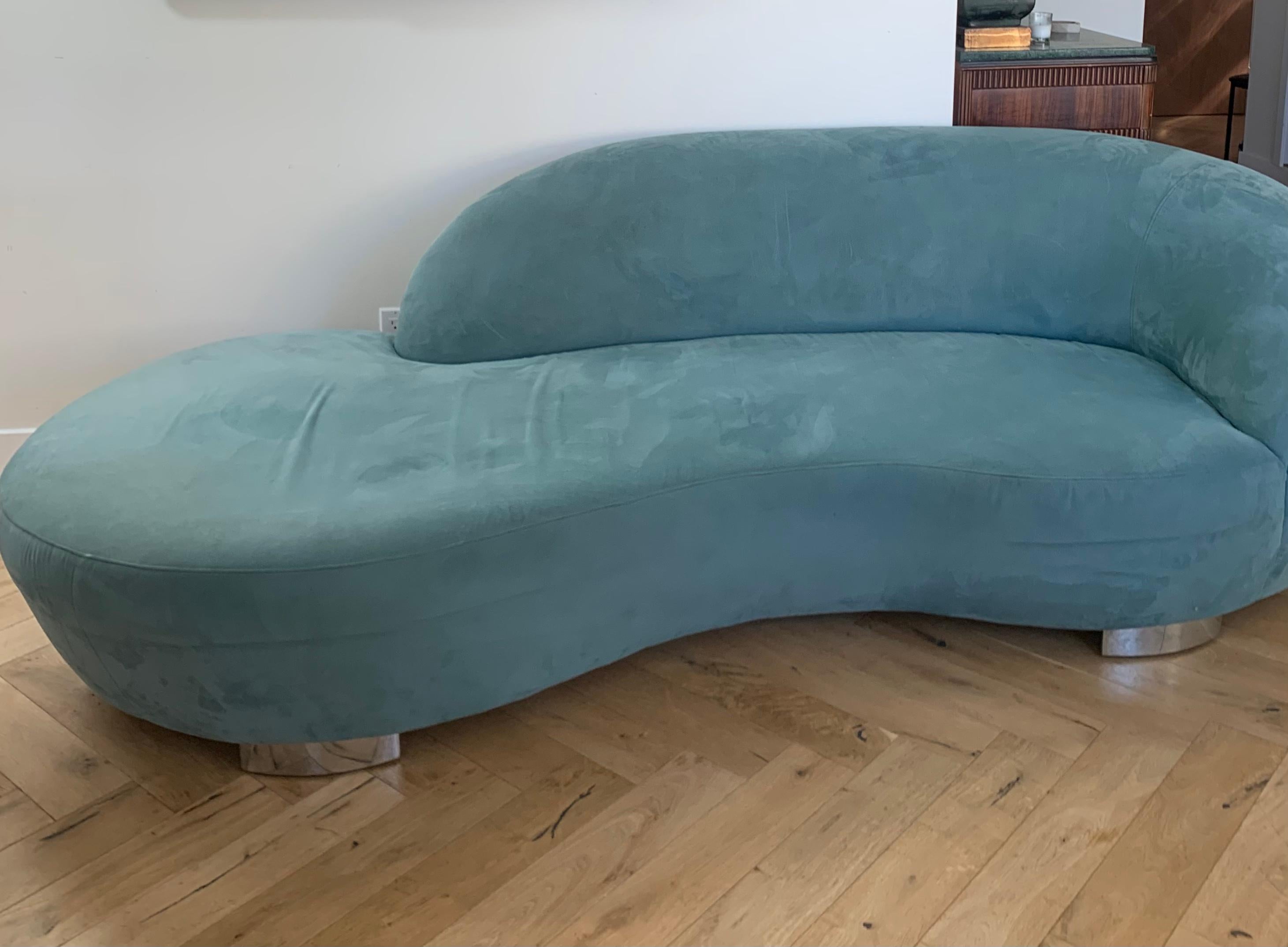 COOL BLUE: Kagan style serpentine sofa in powder blue microsuede with chrome base. Wavy seat with asymmetrical sofa back - possibly real Kagan but cannot authenticate and do the price is a fraction. Light wear to the upholstery but overall quite fab