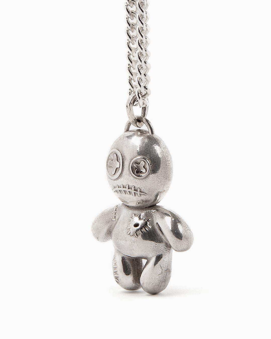Our Voodoo doll is a one-of-a-kind accessory where cuteness meets creepy.

It consists of a 45 cm curb chain and the pendant has a length of 3 cm.

Heavyweight. 

You can choose between Sterling Silver or Vermeil.

This unique piece is handcrafted