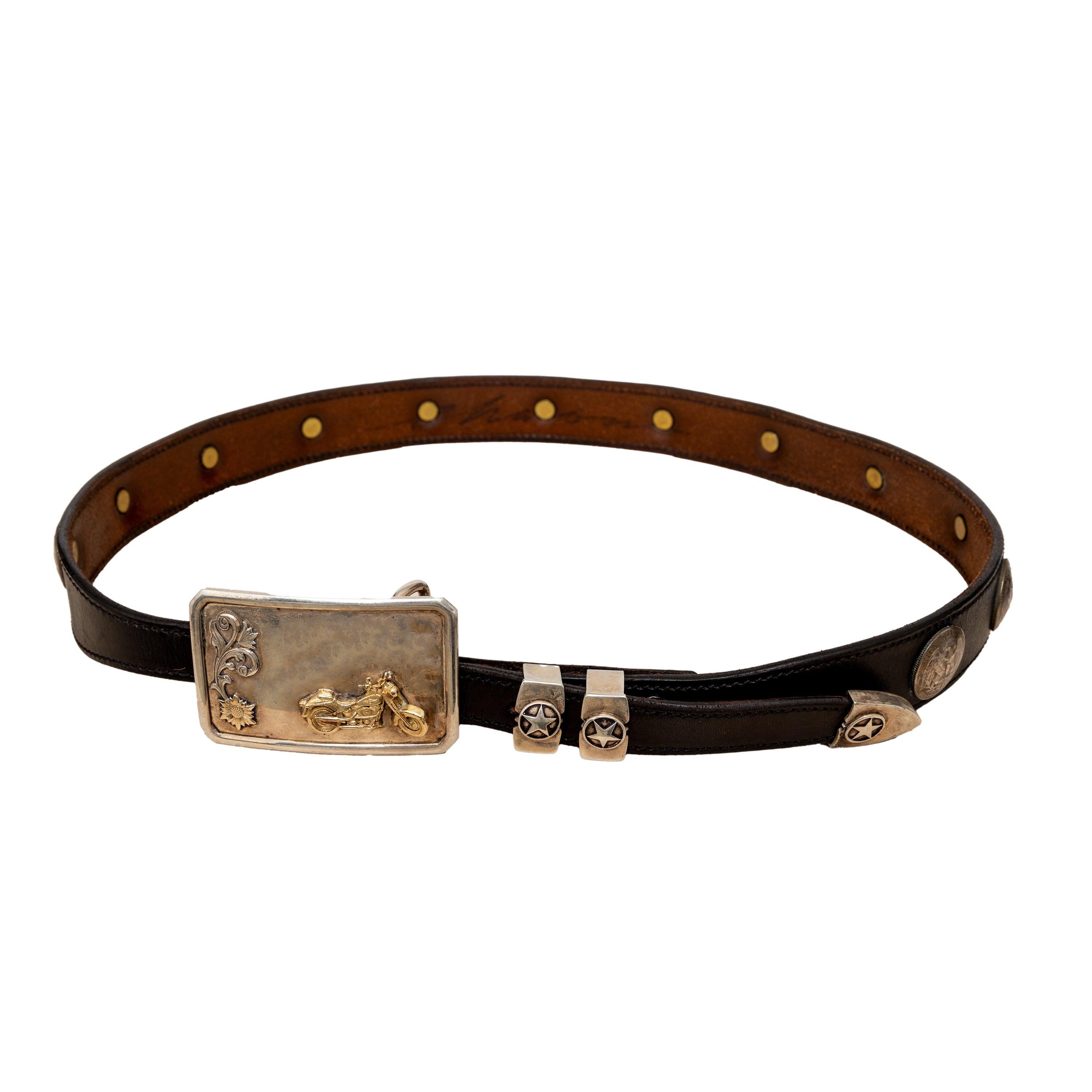 This rare, vintage Vogt Motorcycle Buckle Coin Belt from the 80s is a work of art and a true collector's item. Handmade in Old Mexico, it boasts a heavy, handcrafted Sterling Silver and 14K Gold buckle featuring an intricately engraved motorcycle.
