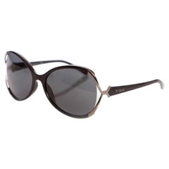 Vogue, schwarz getönte Brille.