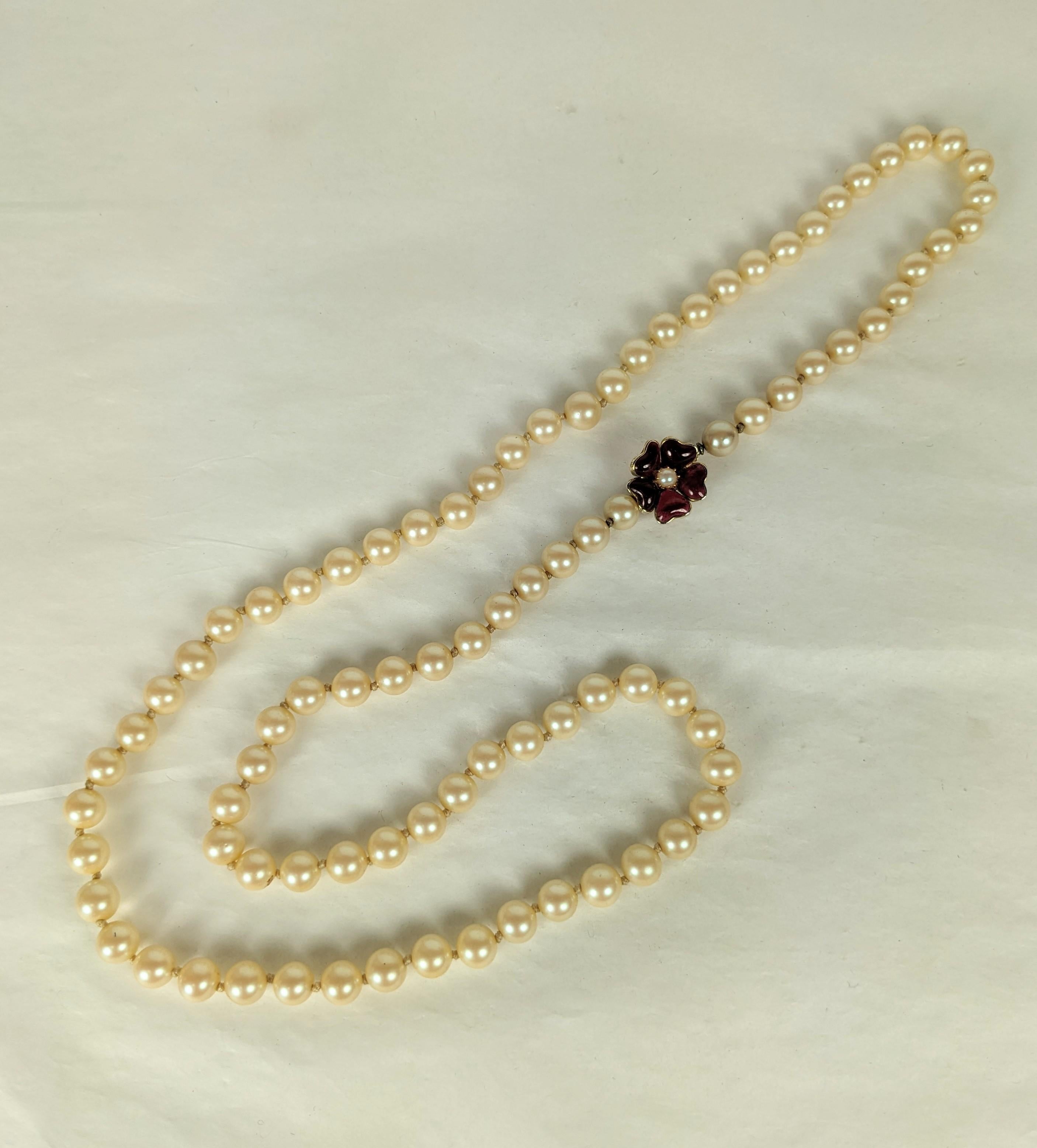 Vogue Faux Pearls with Gripoix Poured Glass Flower Clasp in ruby and faux pearl. Hand knotted. 1950's USA. 29