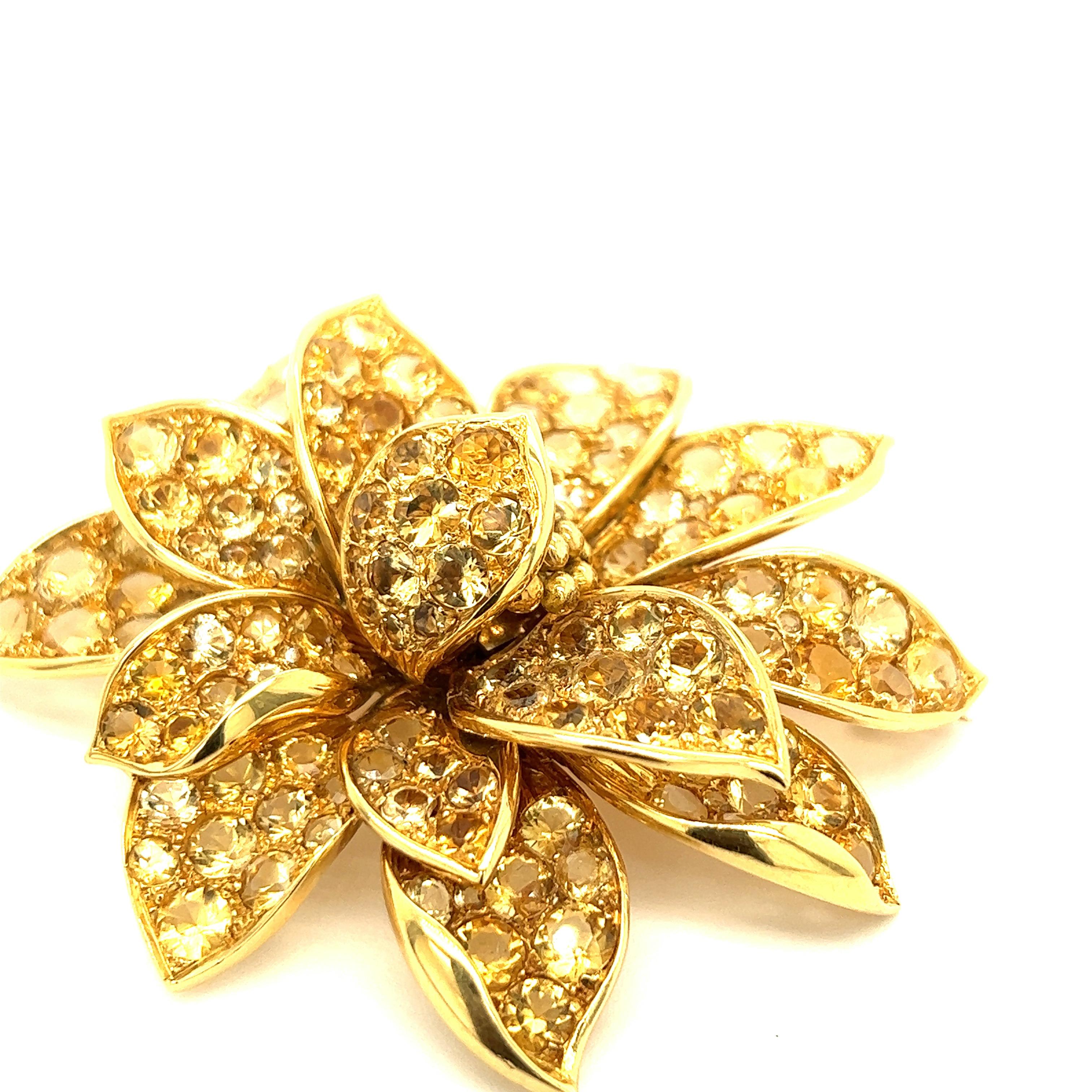 Voirin Sonrel for René Boivin Heliodor Yellow Gold Brooch

A beautiful flower made of 18 karat yellow gold, featuring pavé-set circular-cut heliodors and a beaded gold center; signed with maker's mark for Voirin Sonrel (faded)

Size: width 2.38