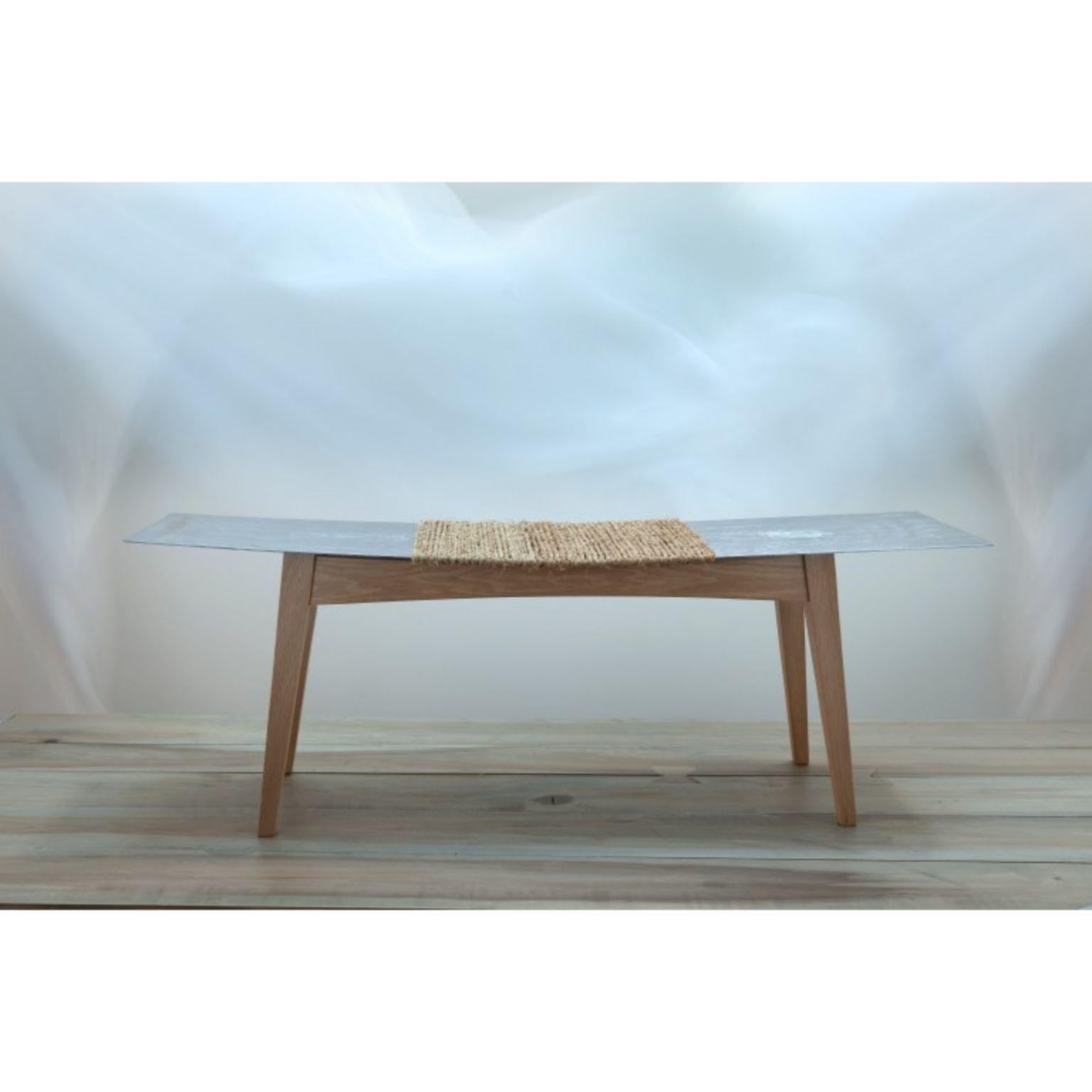 Vol2 bench by Jean-Baptiste Van den Heede
Signed and numbered
Dimensions: L 115 x W 32 x H 43 cm
Materials: Oakwood, metal sheet seat, Natural handwoven esparto fiber

The VOL2 bench is a piece of furniture for the entrance to the house,