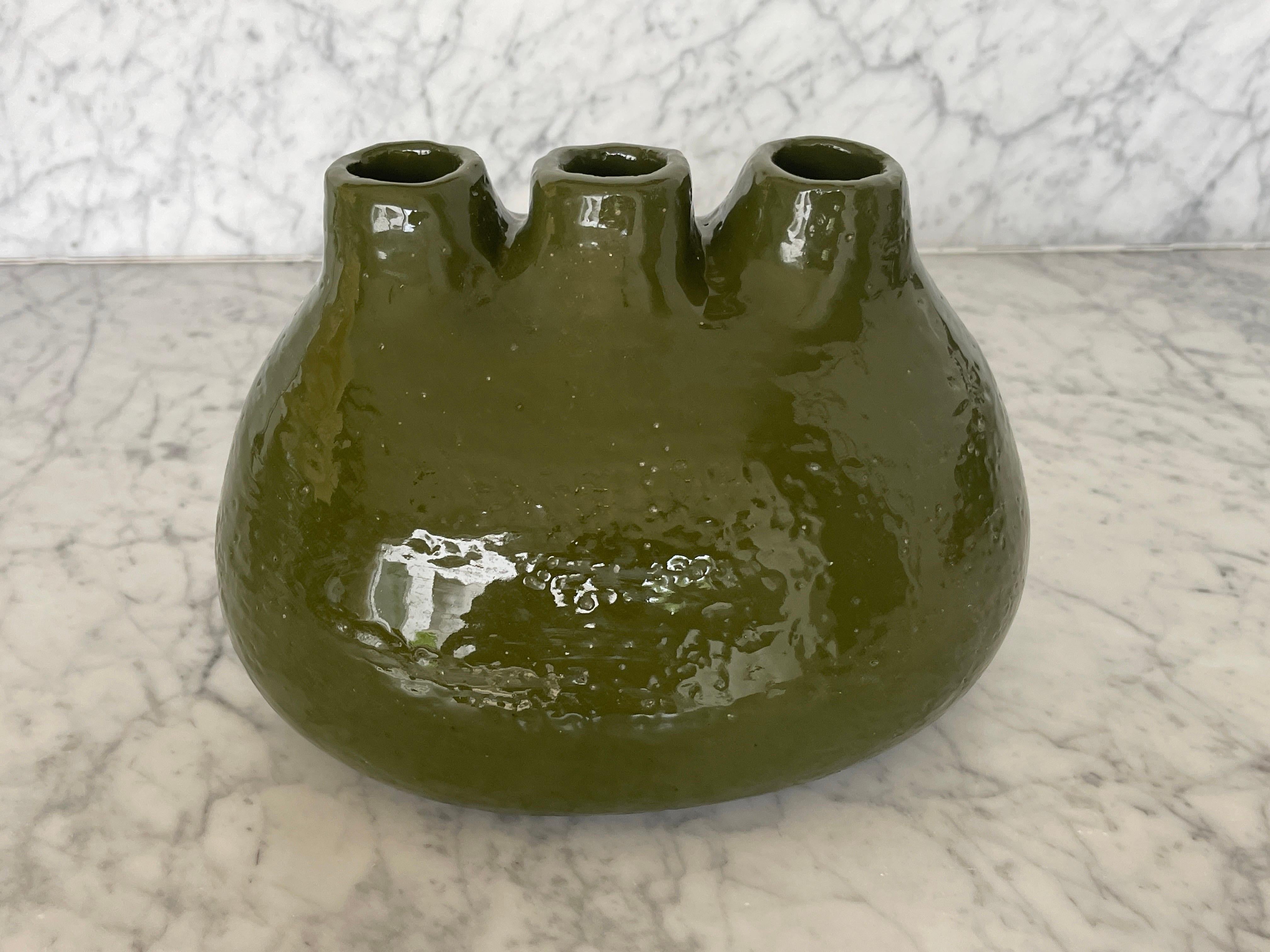 Handmade ceramic vessel in avocado green by Chilean Belgian artisy Mariela Ceramica