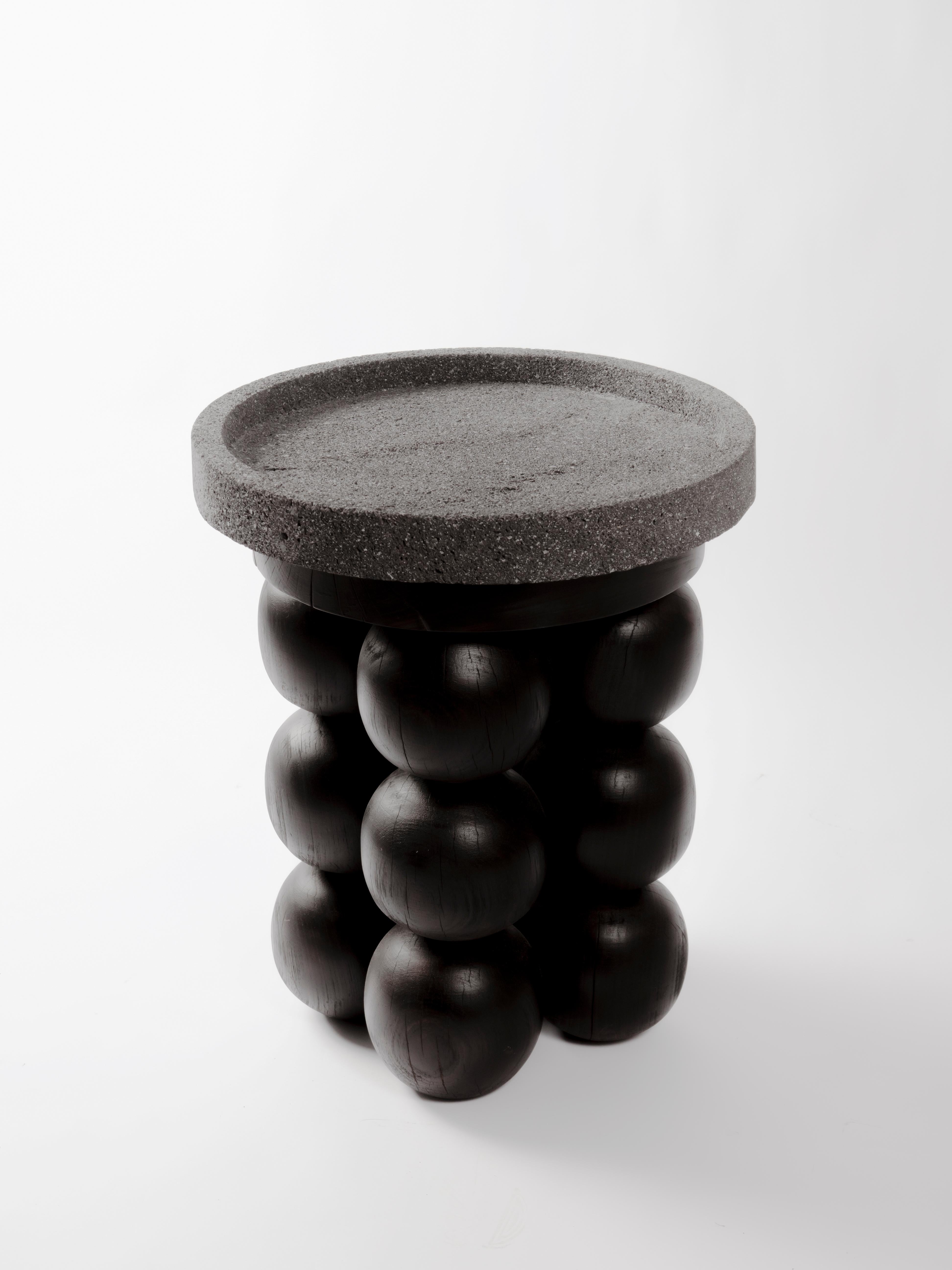 Volcanic and Wood Totem 02 Side Table by Daniel Orozco
Material: Solid wood, Volcanic Stone
Dimensions: D 45 x H 61 cm

Table with volcanic stone cover and 3 ball legs with black finish. Handmade by Mexican artisans.

Daniel Orozco Estudio
We are an