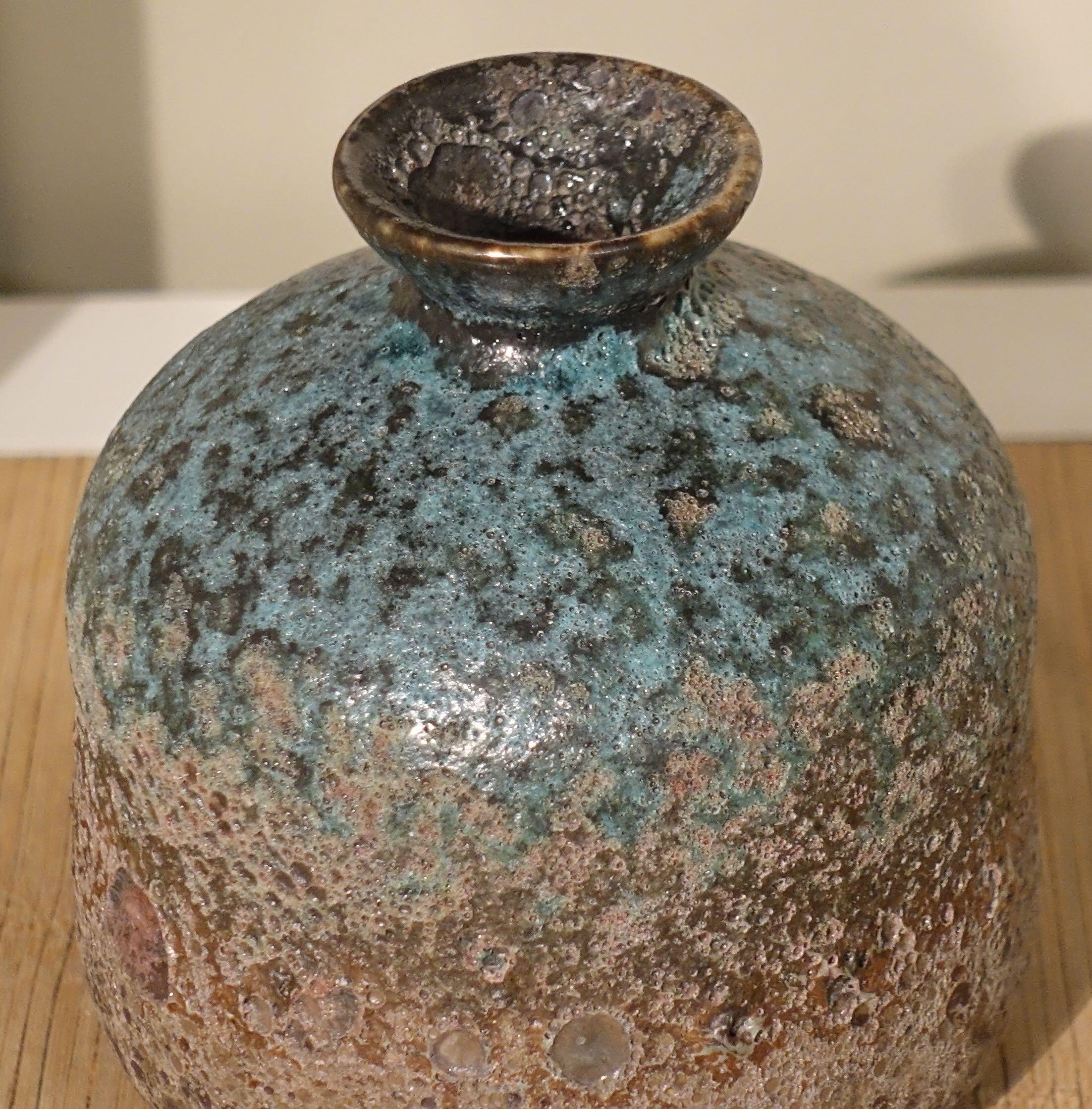 Contemporary Chinese textured volcanic glaze vase with thin mouth
Sits well as part of a collection
S5142/3/4/5
