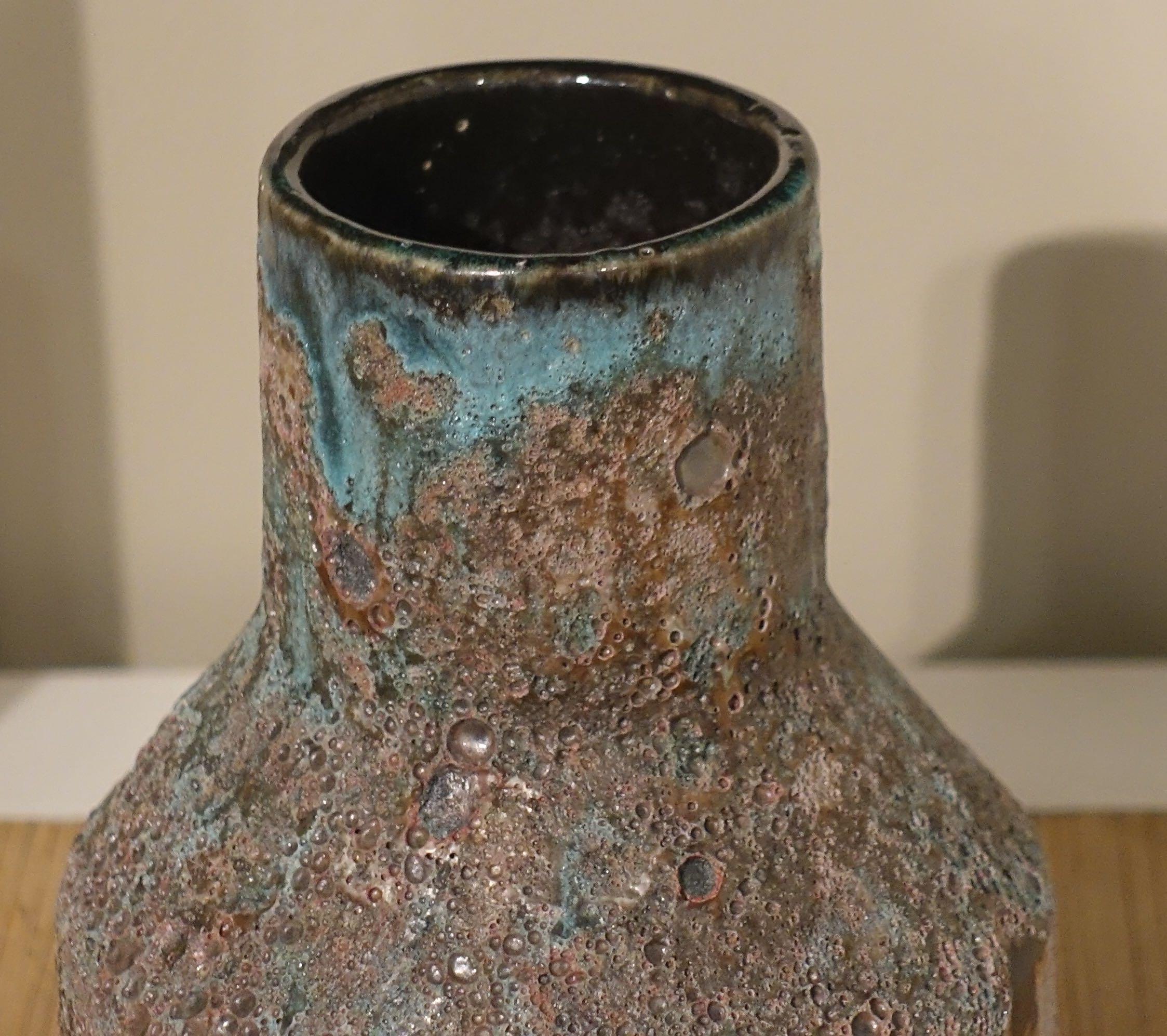Contemporary Chinese textured volcanic glaze vase with conical mouth opening
Sits well as part of a collection
S5141/2/3/4.
 