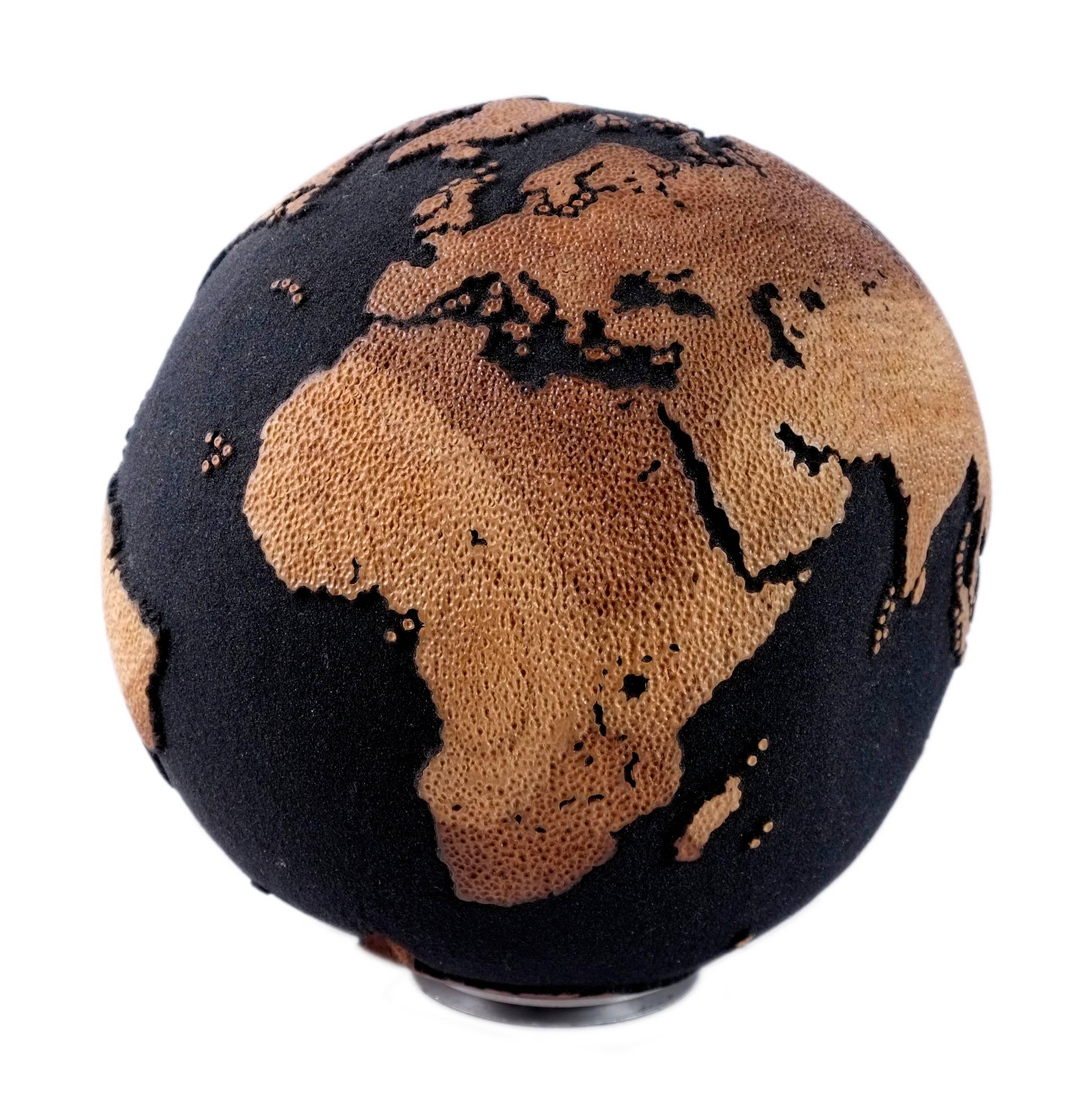 Artistic creativity is a whirlpool of imagination that swirls in the depths of the mind.

Elegant hand carved wooden globe made of teak root with hammered skin texture on the continents, and volcanic sand finishing. A perfect addition to your space