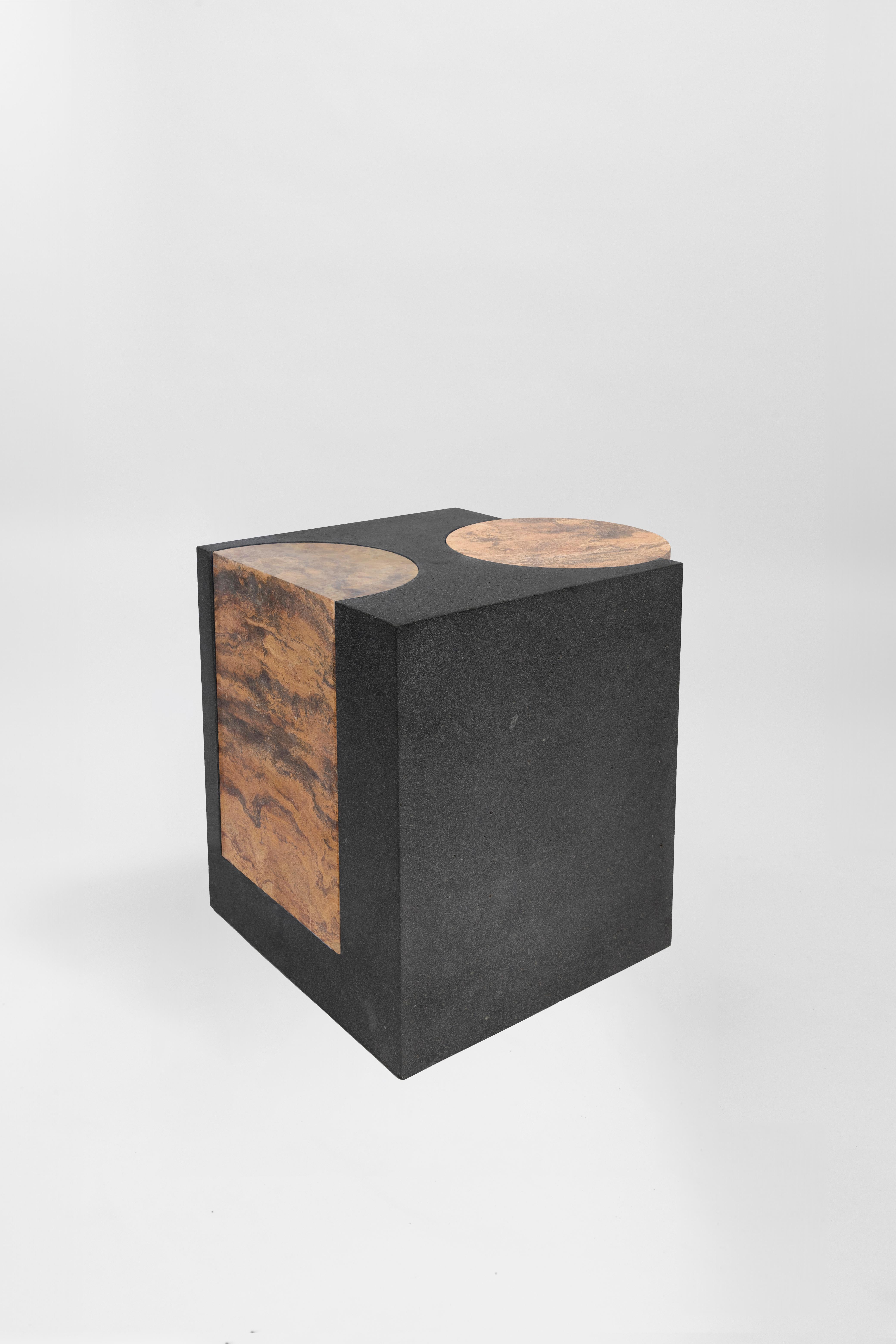 Materials: Lava stone and red travertine
Indoors and outdoors
Side table / Stool

**As this work is made of natural stone, color and veins may vary from the photo**

Through an abstract geometric language where cubes and cylinders playfully