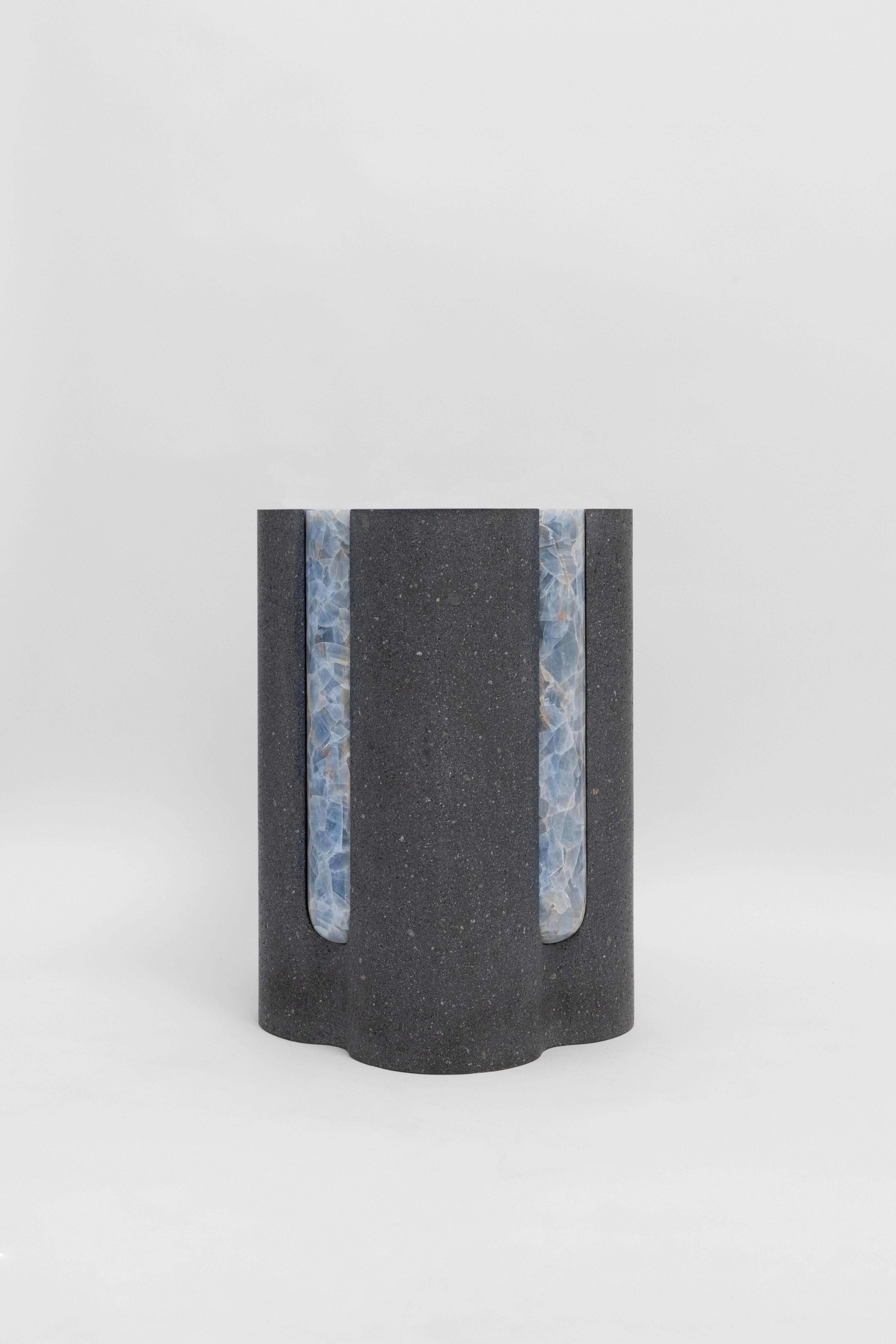 Materials: Lava stone and blue calcite
Indoors and outdoors
Side table / Stool

Through an abstract geometric language where cubes and cylinders playfully alternate, these stools represent the millenary connections existing inside the Earth; they