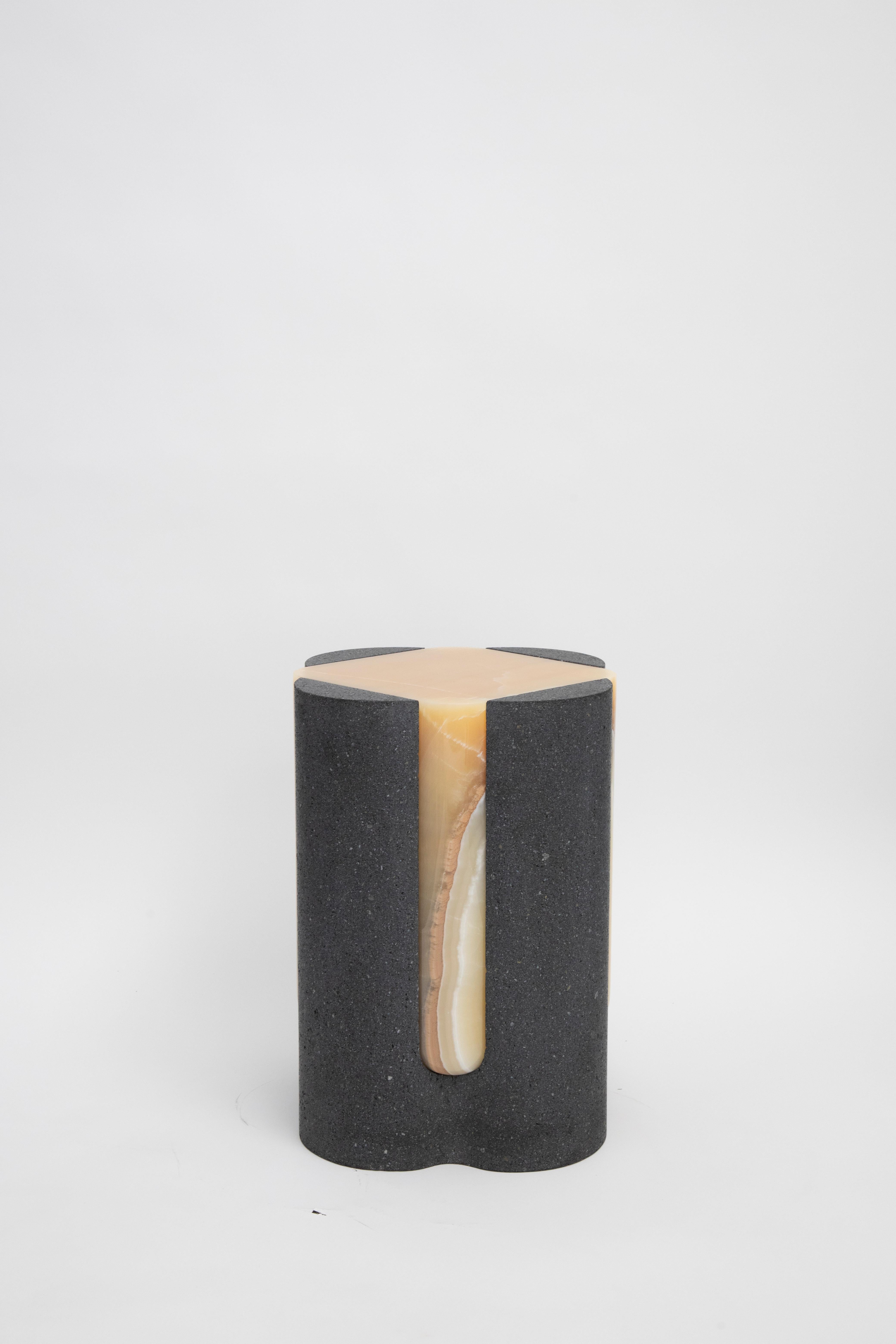 Materials: Lava stone and pineapple onyx
Indoors and outdoors
Side table / Stool

Through an abstract geometric language where cubes and cylinders playfully alternate, these stools represent the millenary connections existing inside the Earth; they