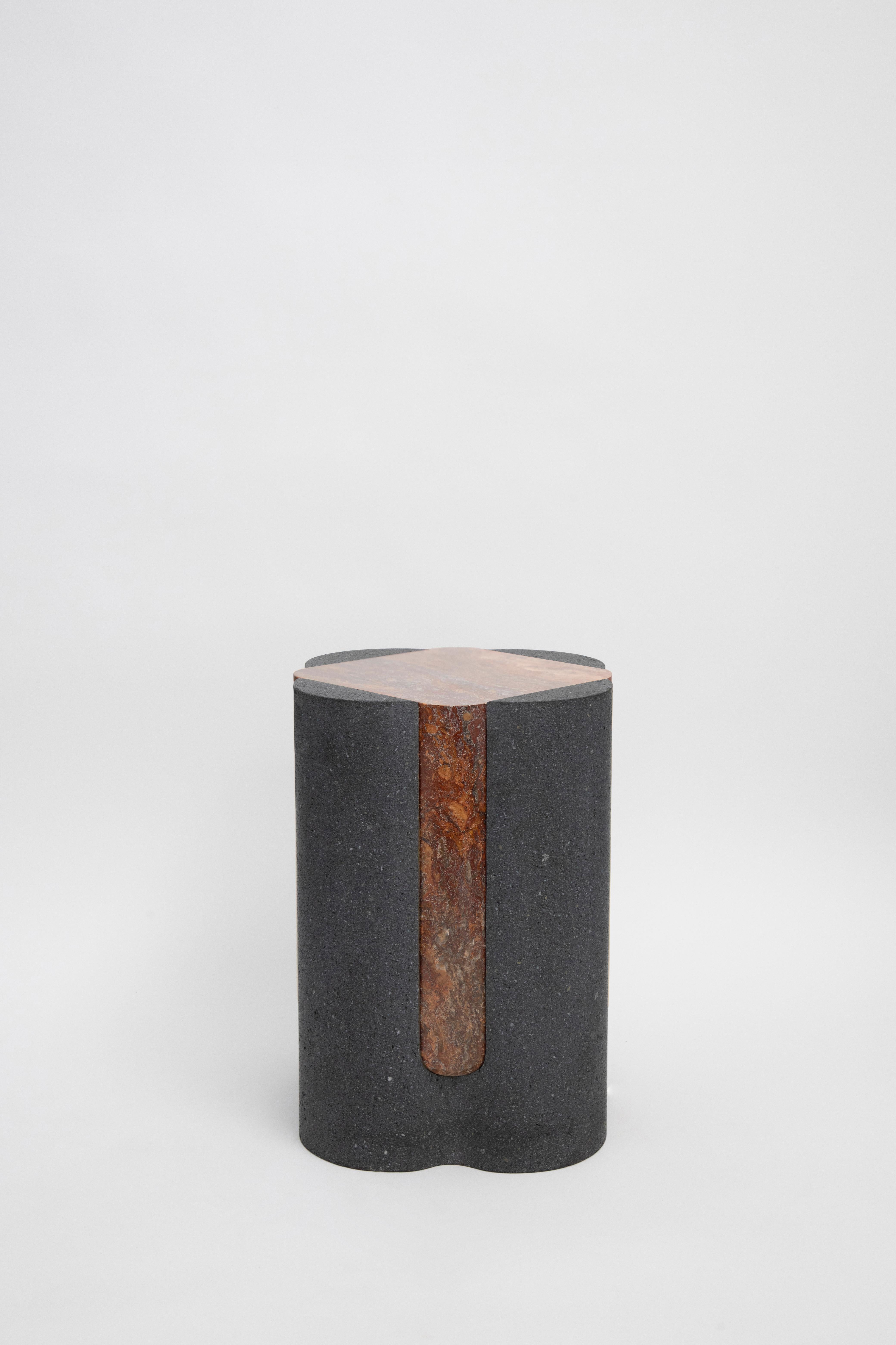 Materials: Lava stone and red travertine
Indoors and outdoors
Side table / Stool

Through an abstract geometric language where cubes and cylinders playfully alternate, these stools represent the millenary connections existing inside the Earth; they